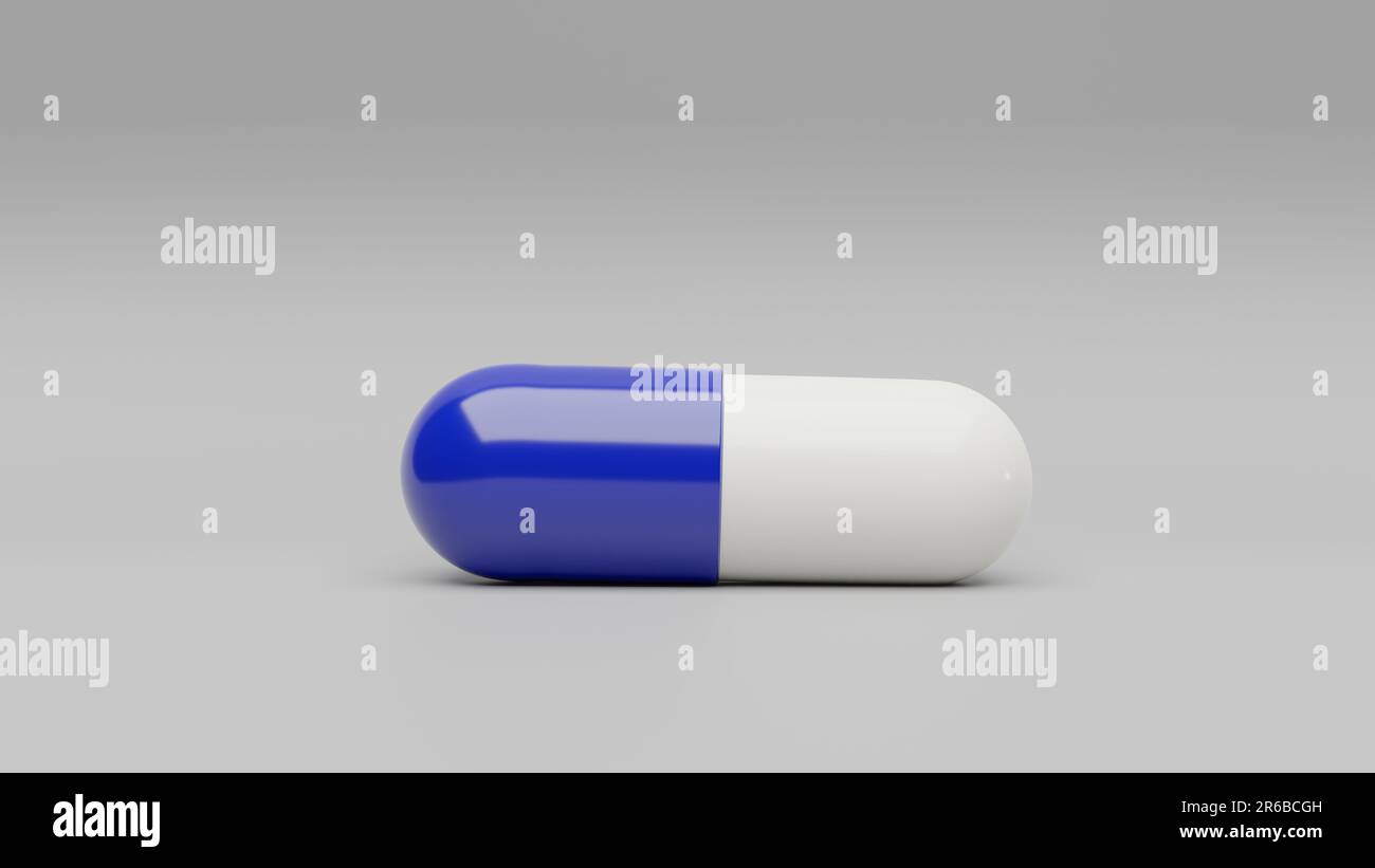 Una pillola di capsula bianca blu scuro su uno sfondo bianco - medicamenti sanitari della medicina Foto Stock