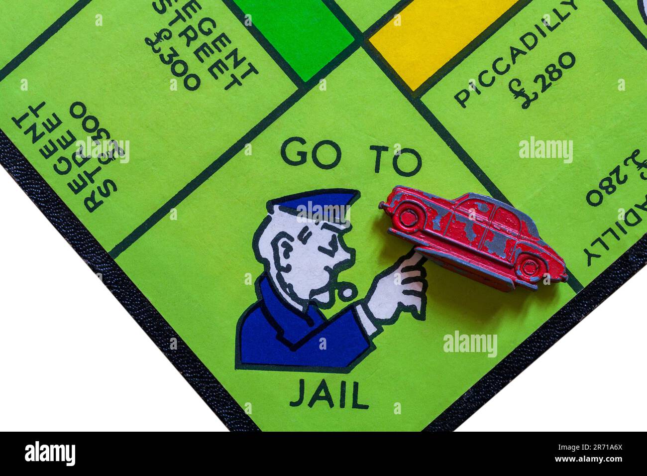 Vai in prigione con il simbolo di auto rosso su Vintage Monopoly Property Trading Board gioco marchio 711981 Foto Stock