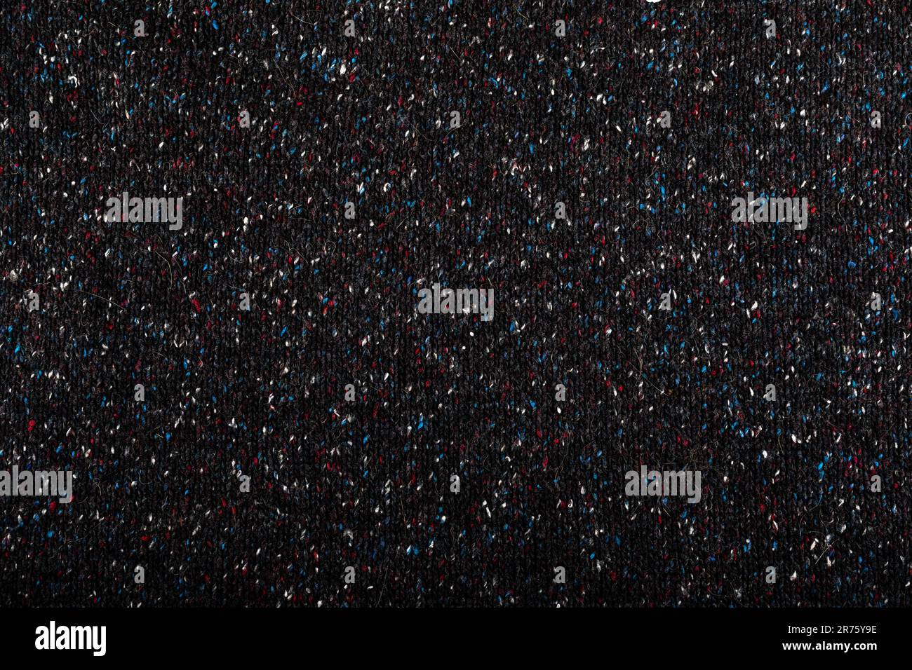 Tessuto a maglia colorato e macchiato in nero. Foto Stock