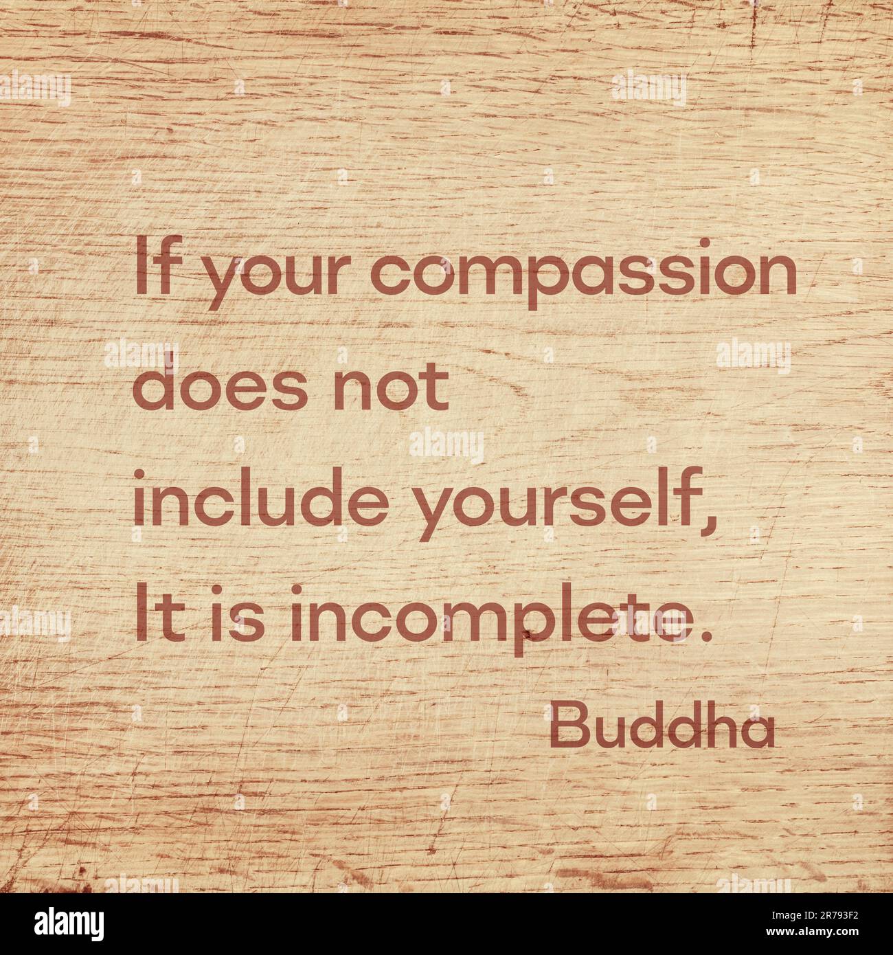 Se la vostra compassione non include voi stessi, è incompleta - famosa citazione del Buddha di Gautama stampata su una tavola di legno grunge Foto Stock