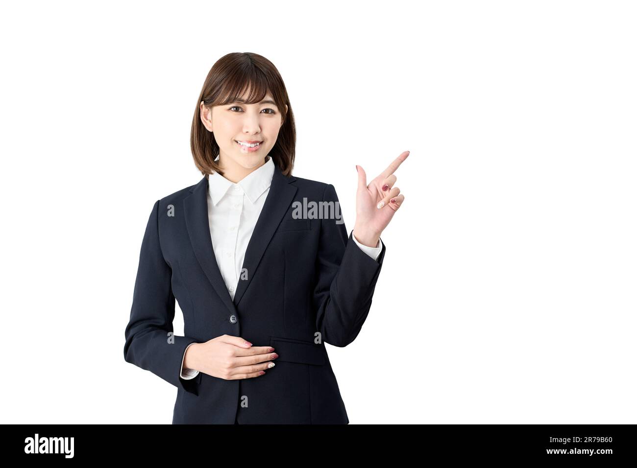 Donna asiatica d'affari che indica uno sfondo bianco Foto Stock