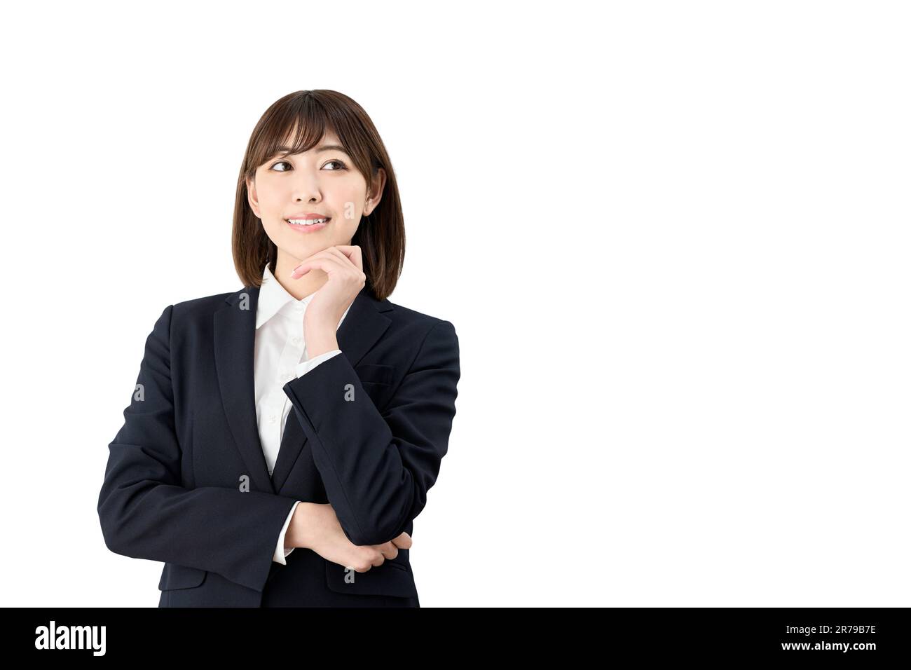 Donna asiatica d'affari che pensa alle cose buone Foto Stock