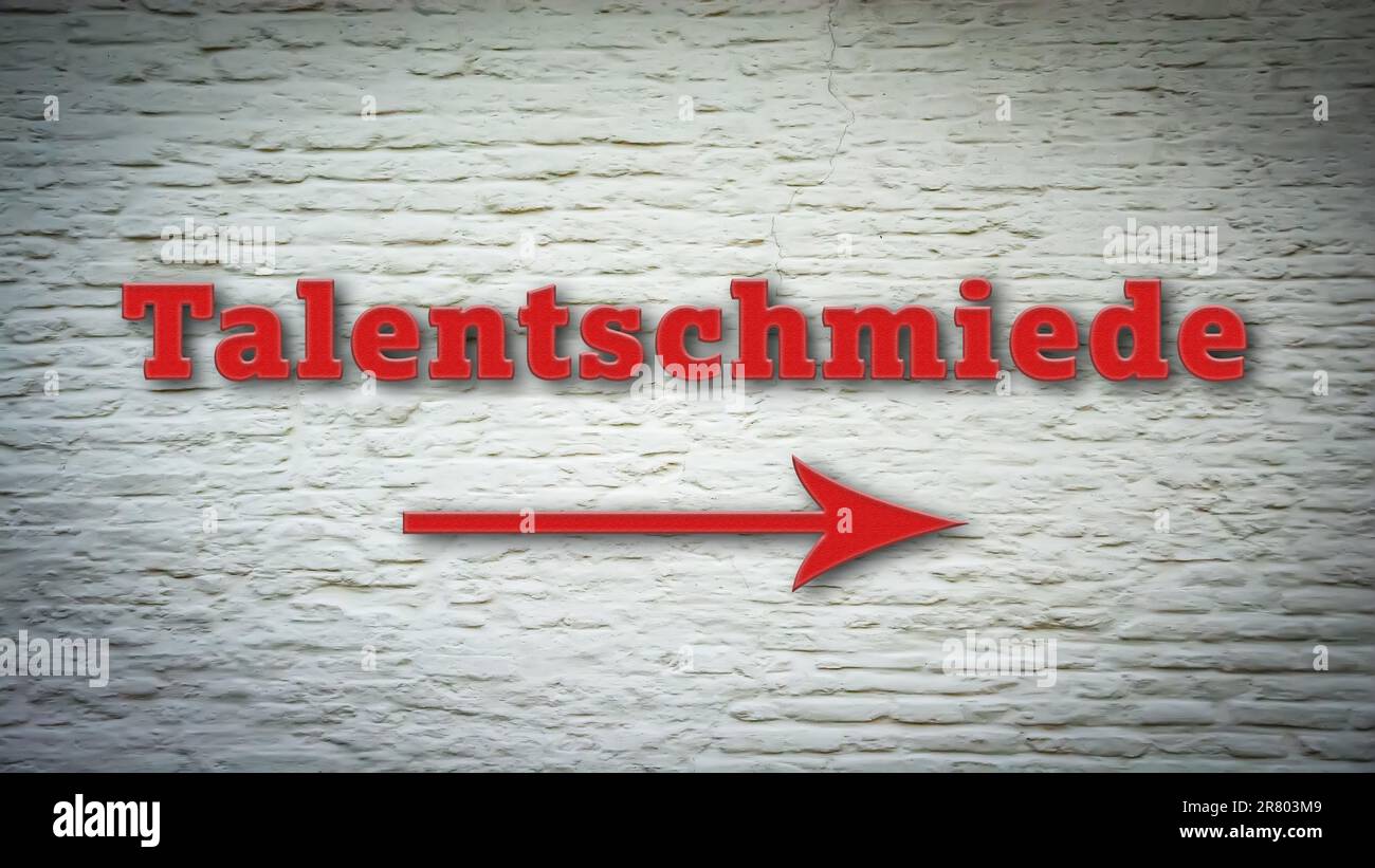 Un'immagine con un cartello in tedesco che punta in direzione della fabbrica di talenti. Foto Stock