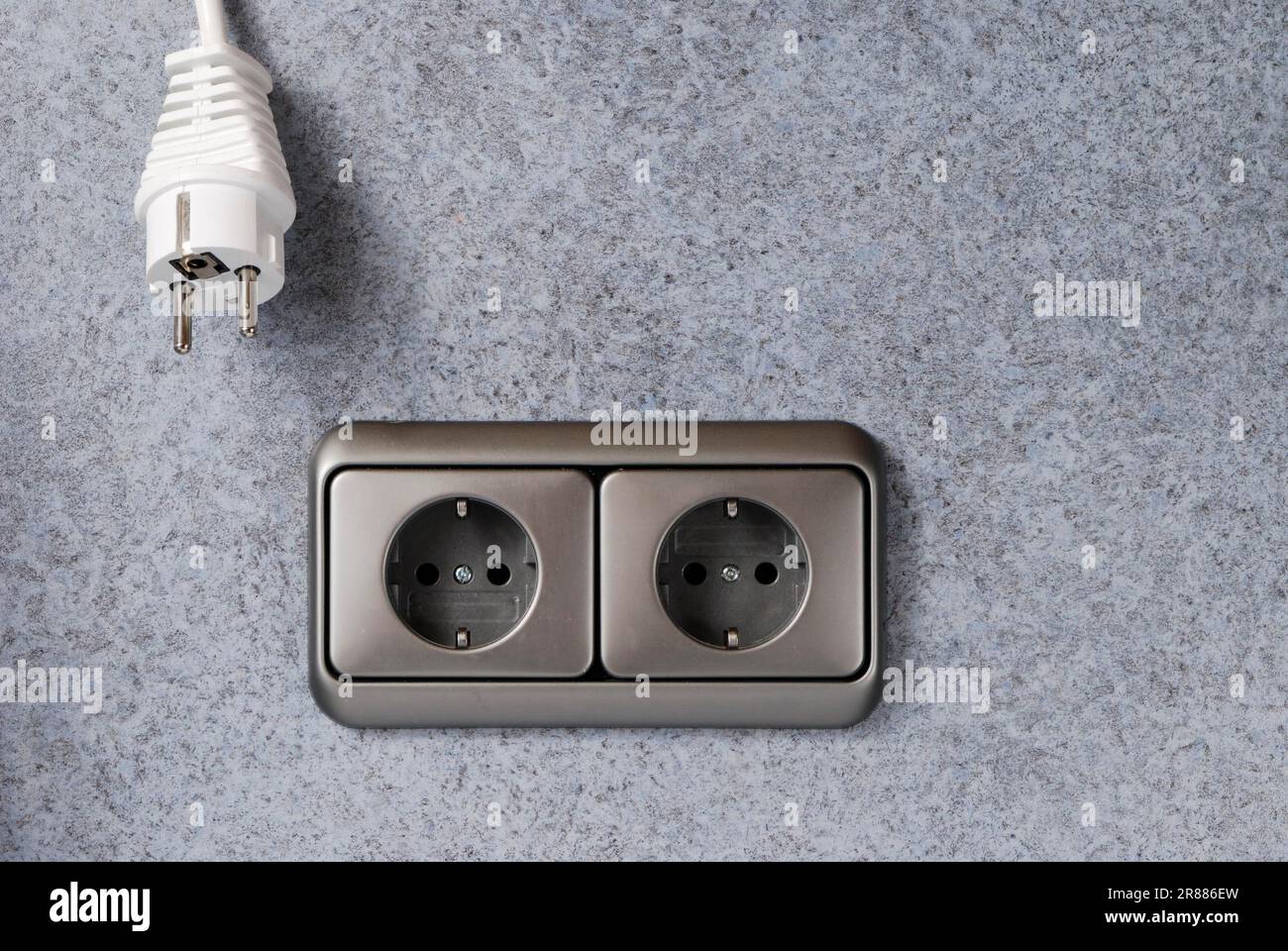 Spina bianca e presa di alimentazione Foto Stock