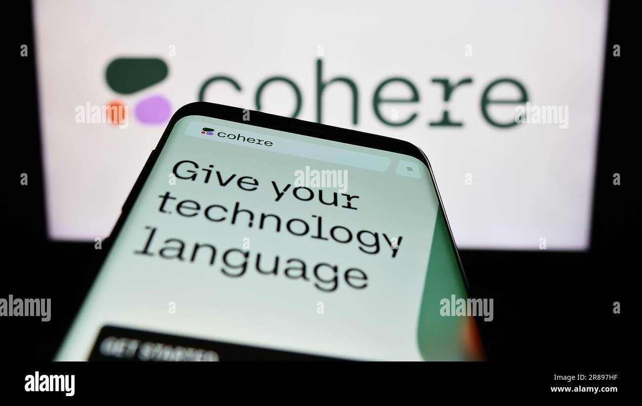 Telefono cellulare con sito Web della società canadese di intelligenza artificiale Cohere Inc. Sullo schermo davanti al logo aziendale. Mettere a fuoco in alto a sinistra sul display del telefono. Foto Stock