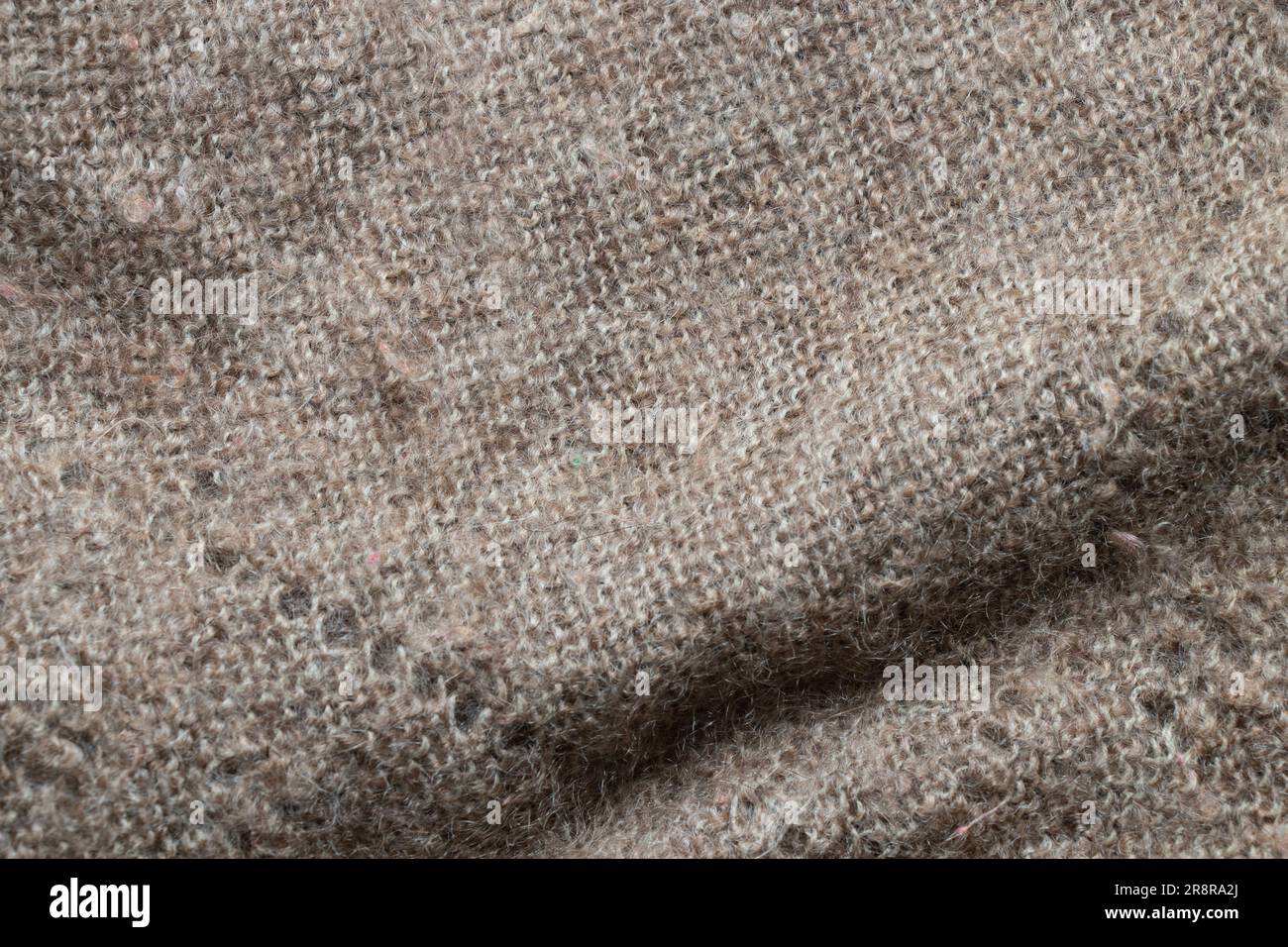 la lana grigia scialle nonna come sfondo, vestiti di lana Foto Stock