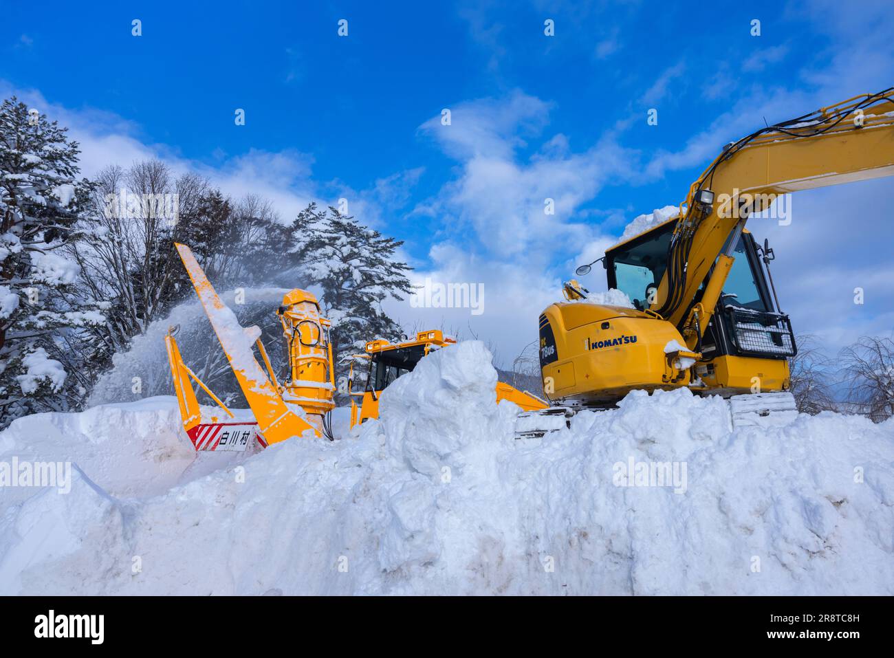 Scenario di rimozione della neve Foto Stock