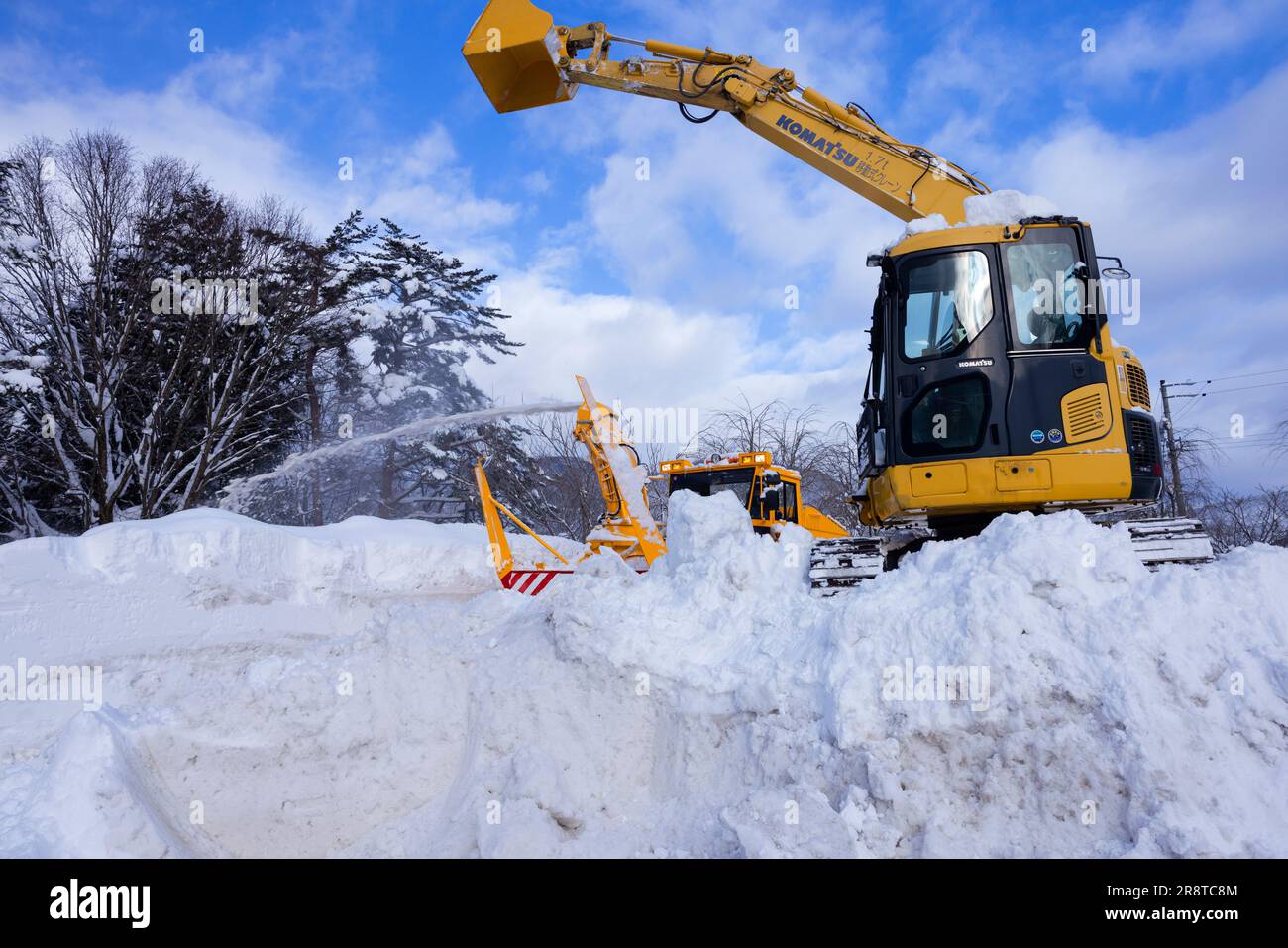 Scenario di rimozione della neve Foto Stock