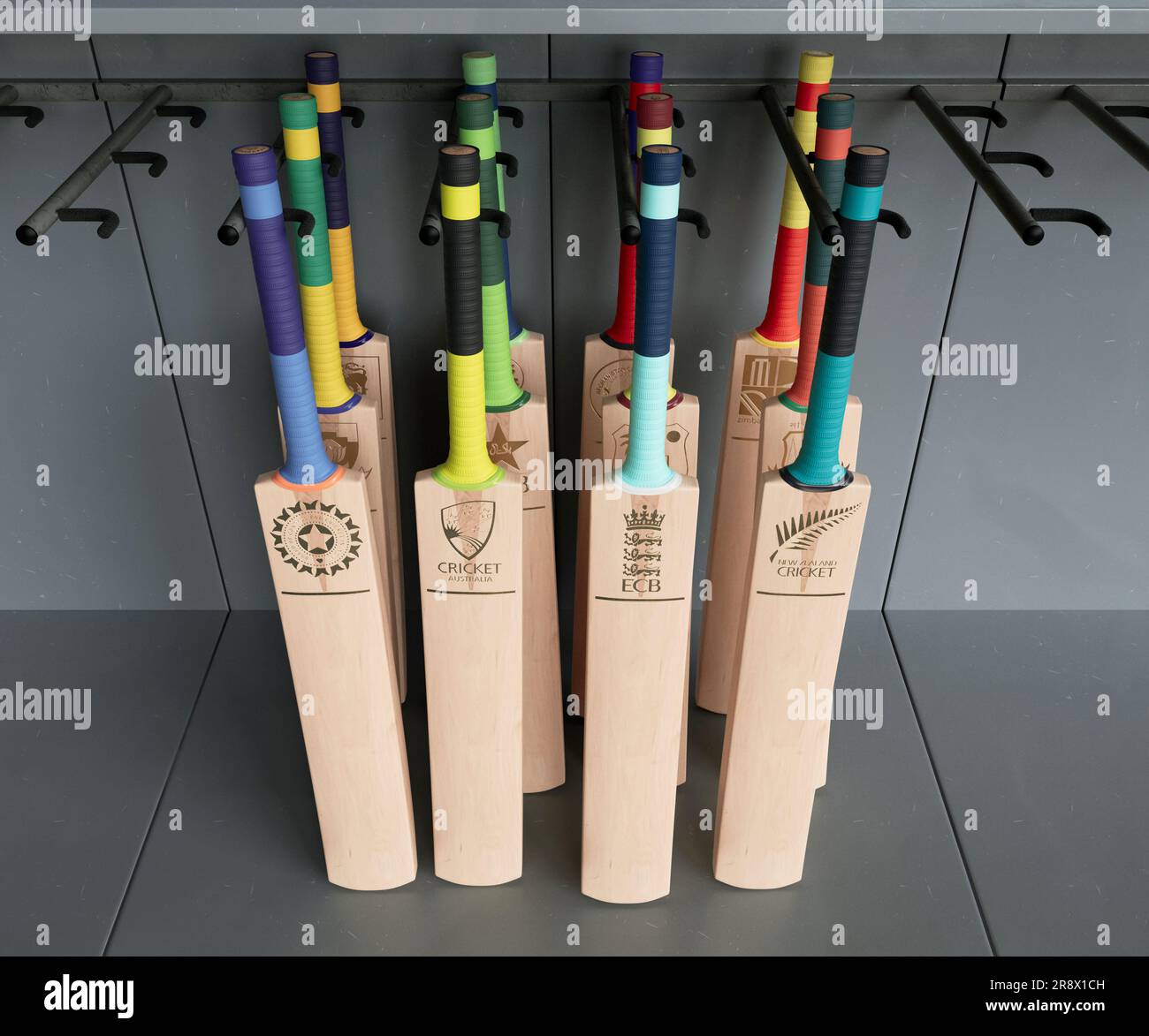 Una collezione di mazze da cricket impresse con loghi dorati dei paesi affiliati all'ICC, disposti su un espositore dello scaffale - 2 aprile 2023 Foto Stock