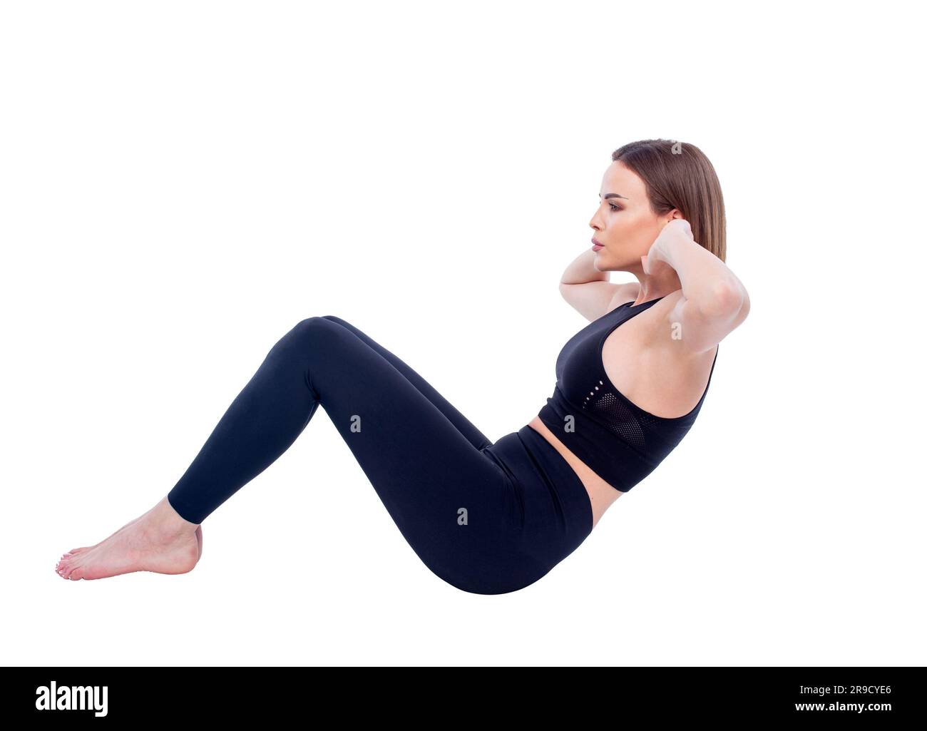 Donna caucasica in forma anni '30 che fa un'attività sportiva, isolata sul colore bianco Foto Stock