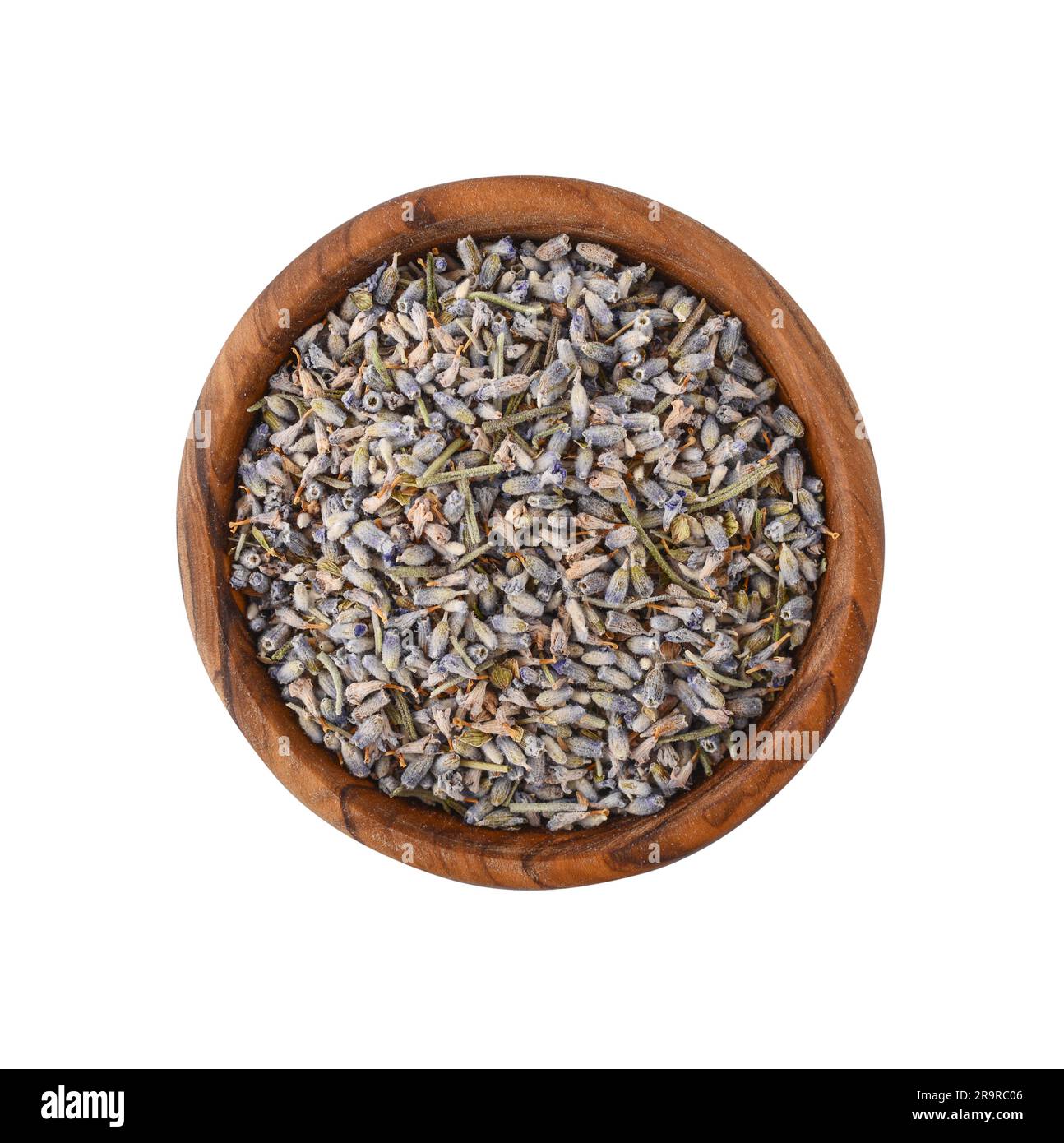 Tè alla lavanda essiccato in una ciotola di legno isolata su sfondo bianco, vista dall'alto Foto Stock