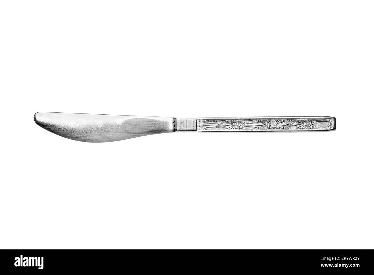 Un stile sovietico metallico inox inox coltello da tavola con decorazioni isolati su sfondo bianco Foto Stock