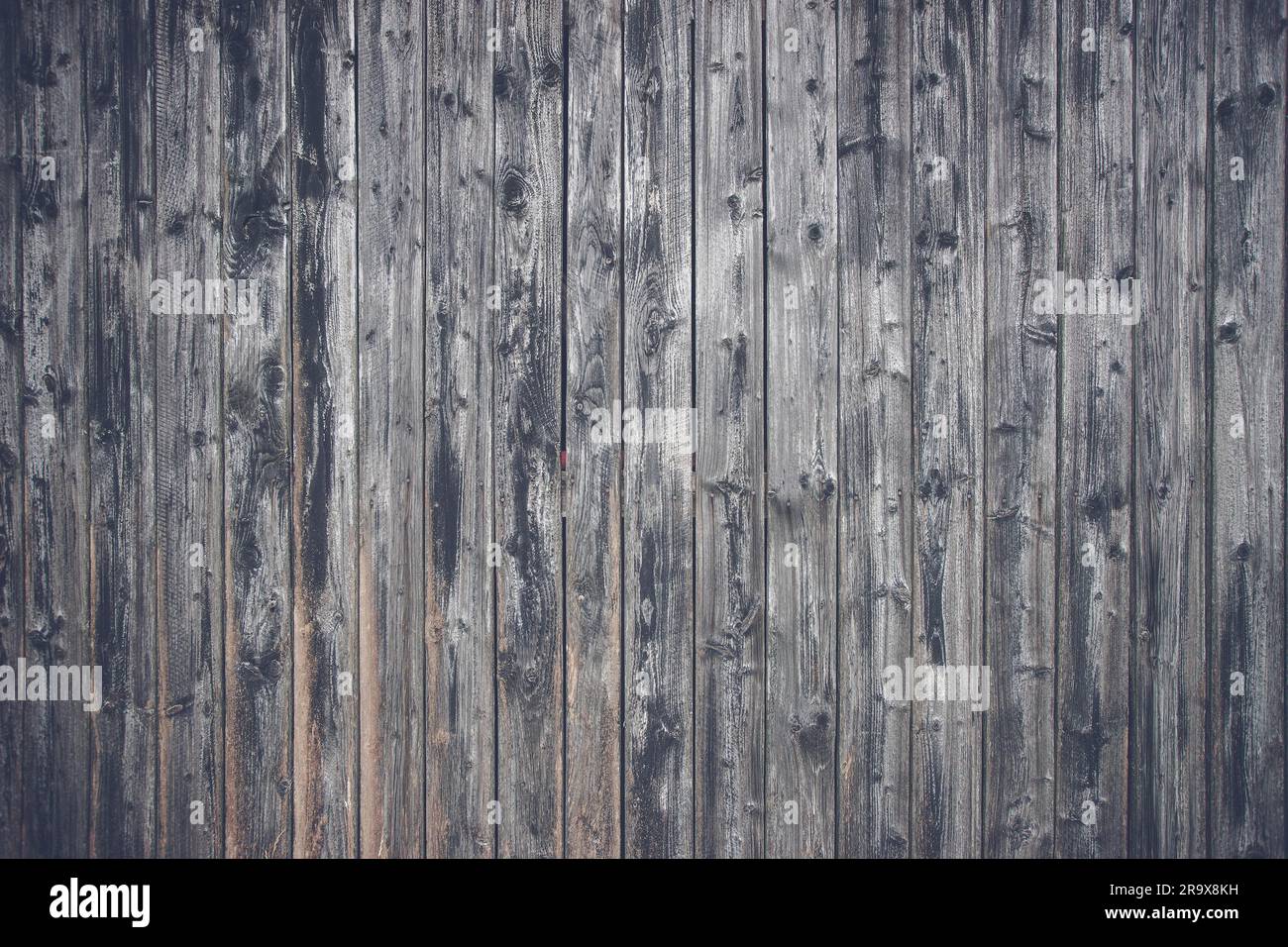 Assi di legno in colore nero con un tono opaco Foto Stock