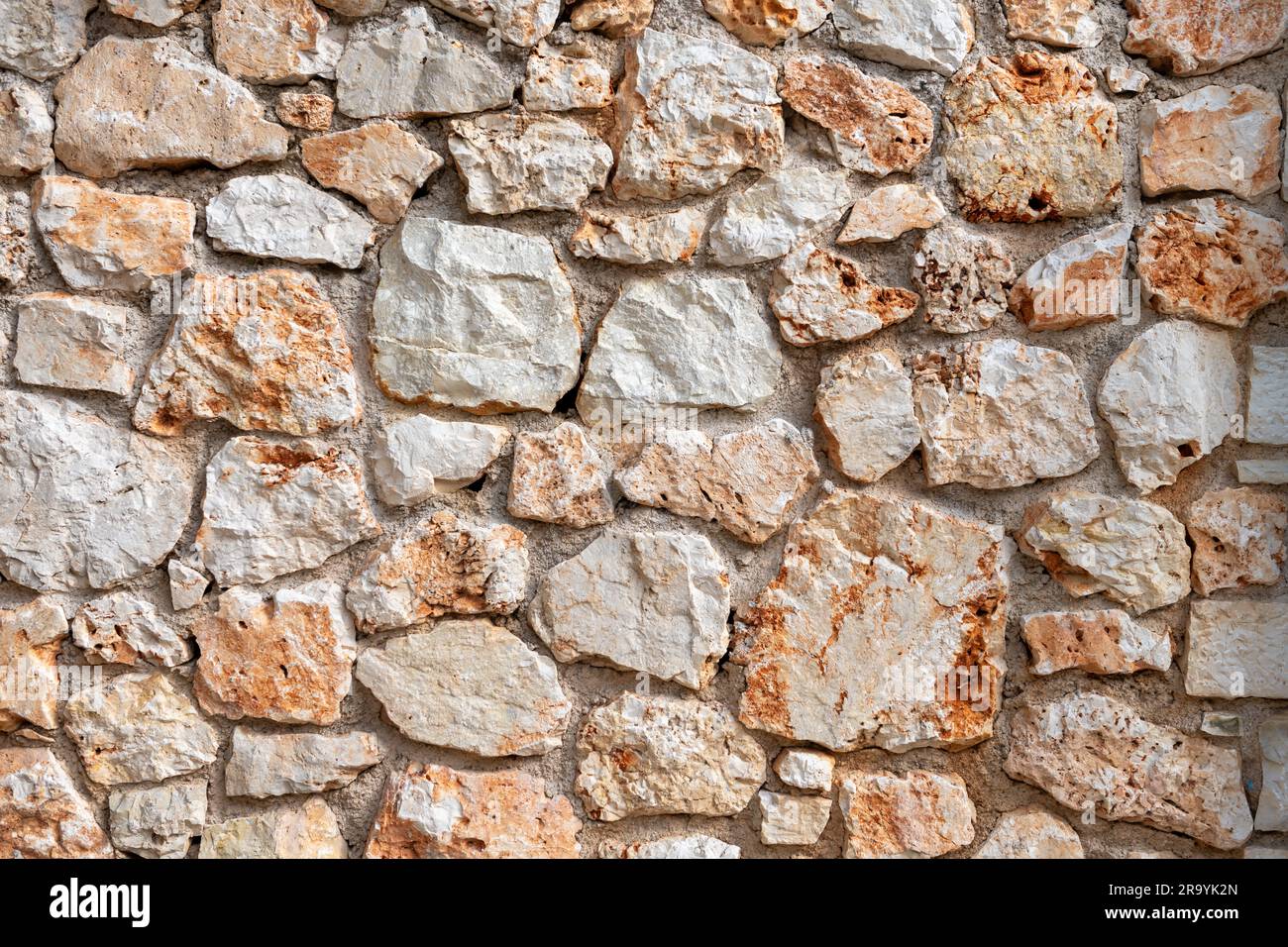 Un muro fatto di pietre lavorate. Foto Stock