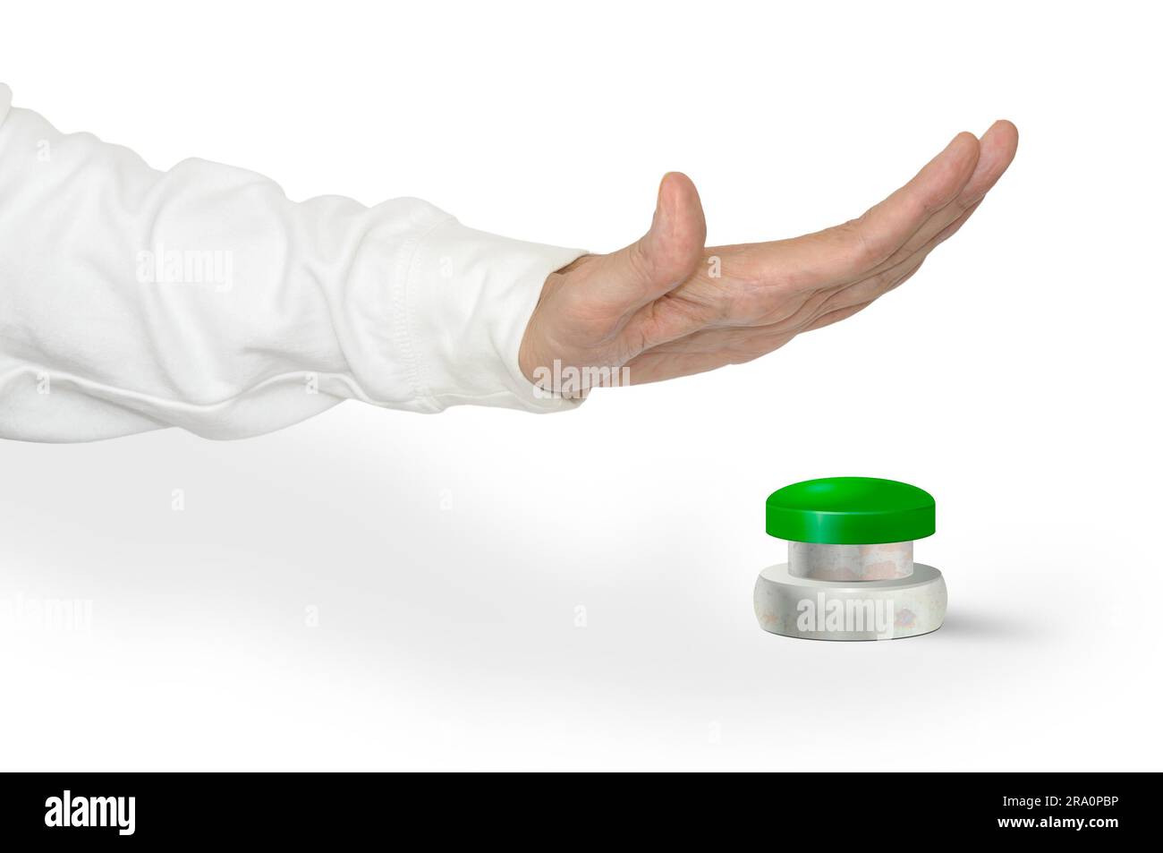 Un uomo che preme con il palmo della mano un grande pulsante verde di allarme START STOP Foto Stock