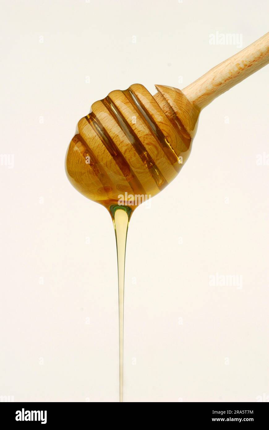 Cucchiaio con miele, cucchiaio di miele Foto stock - Alamy