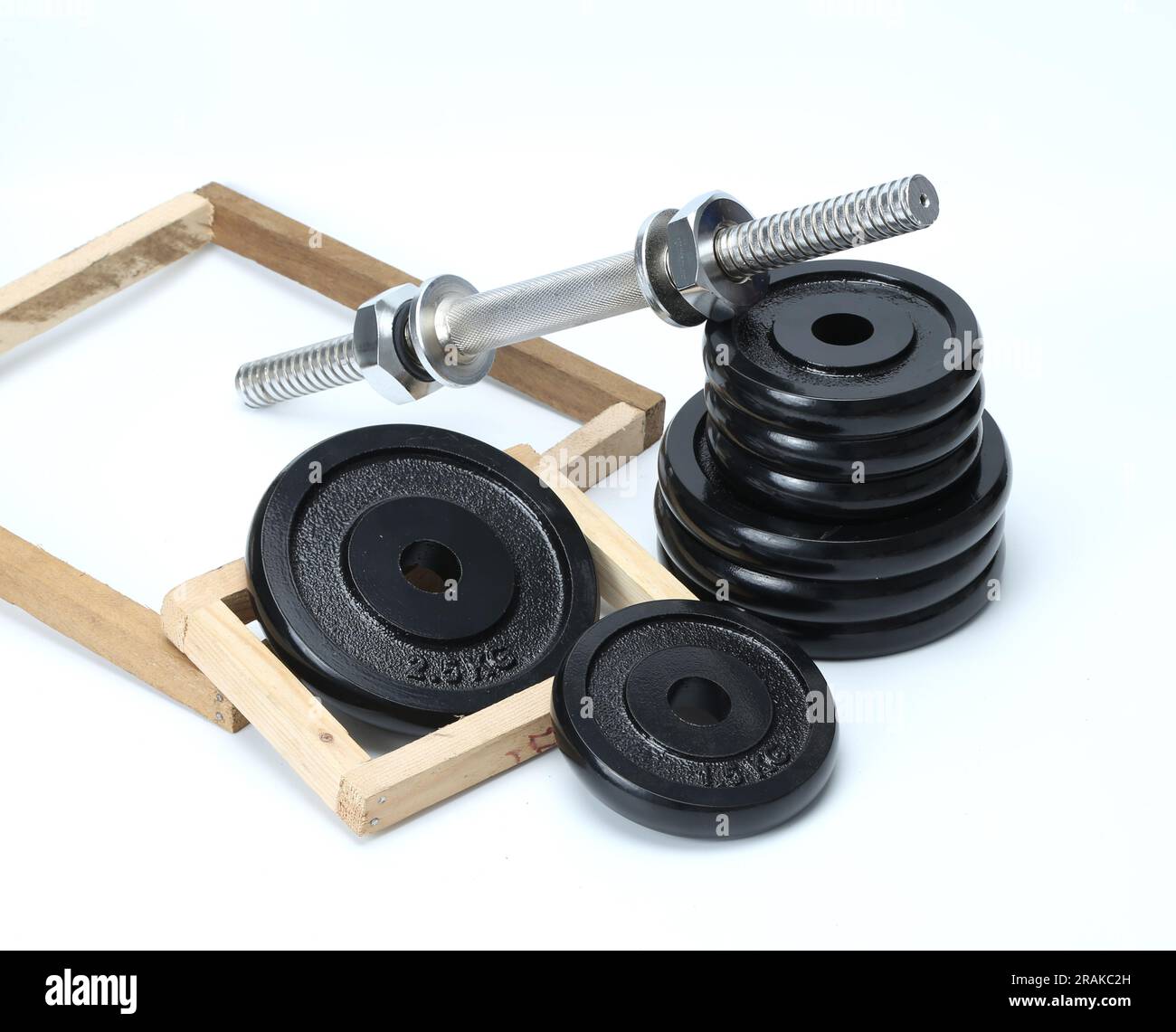 piastre di peso in metallo nero isolate su sfondo bianco Foto Stock