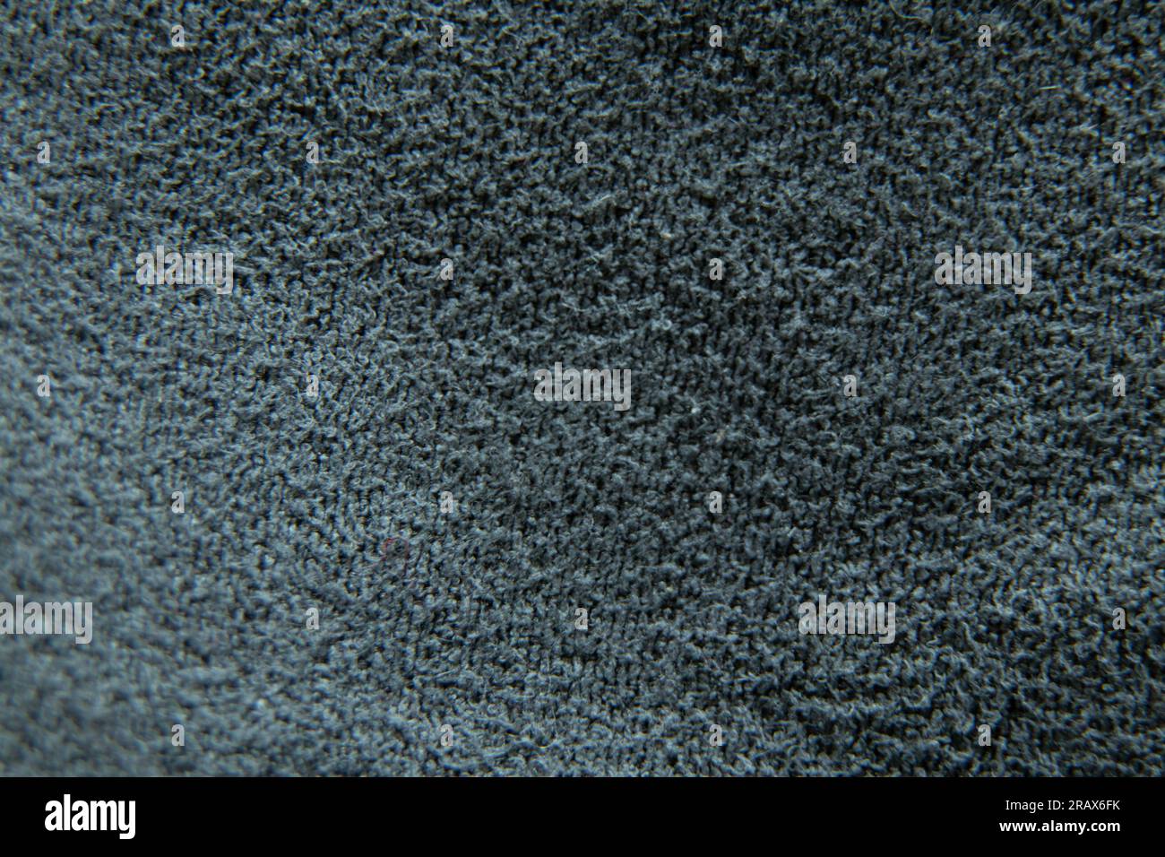 tessuto grigio scuro, foto macro come sfondo in primo piano Foto Stock