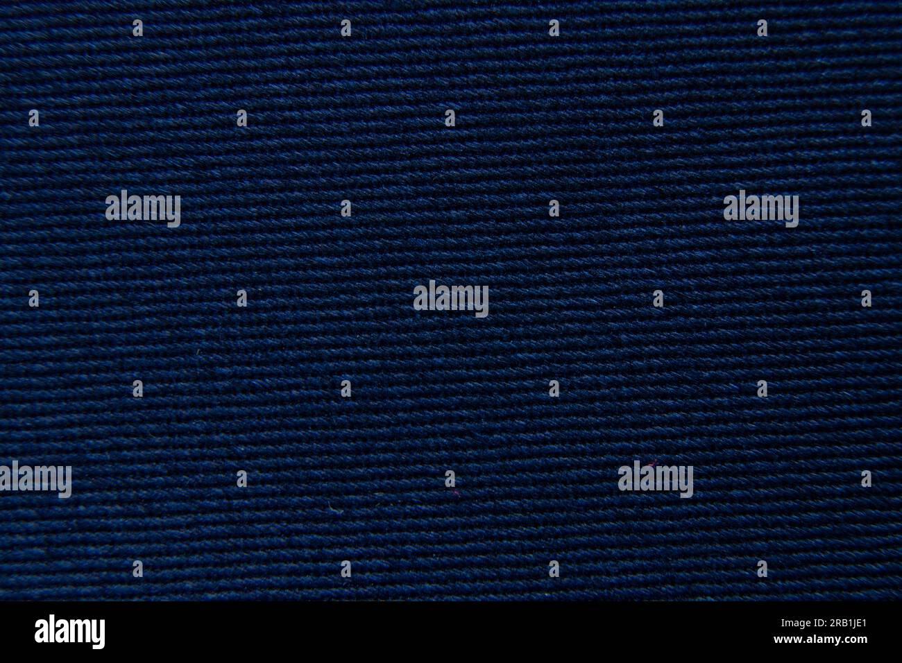 foto macro in tessuto semplice blu scuro come sfondo Foto Stock
