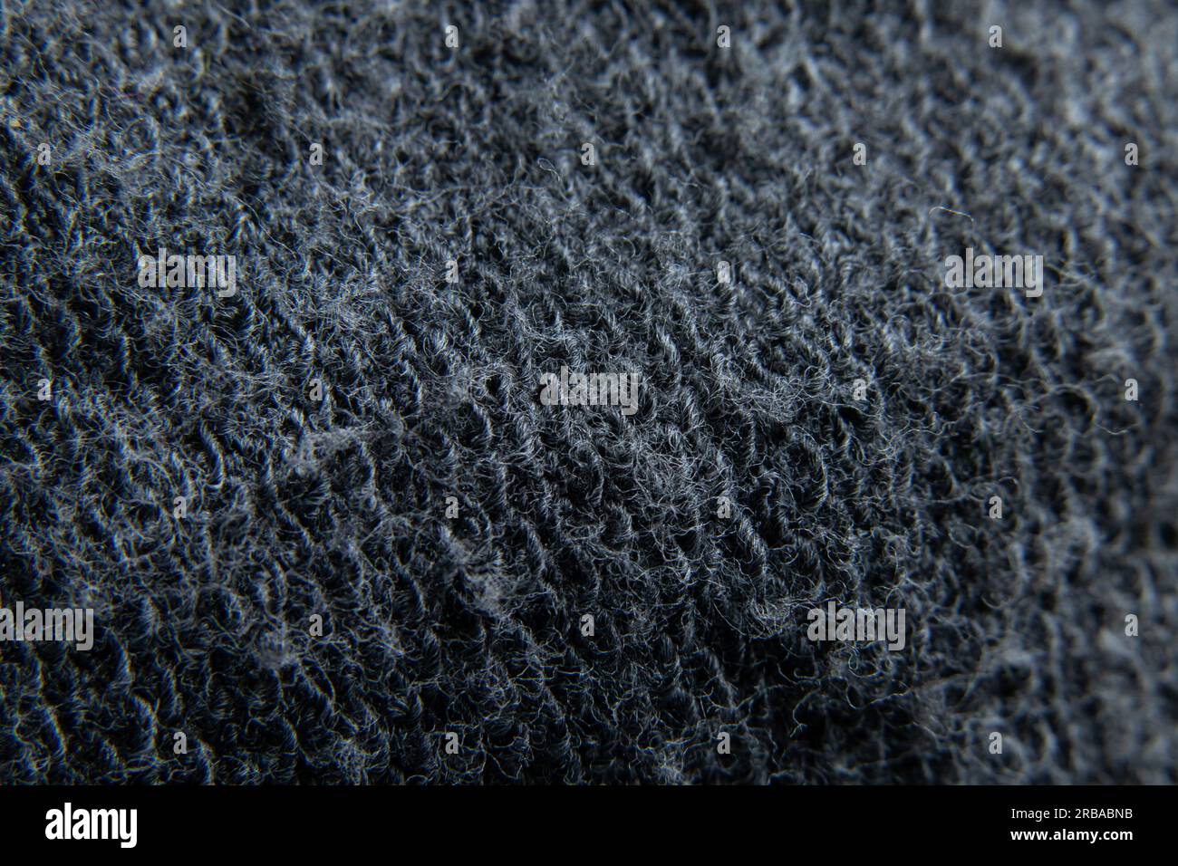 primo piano del tessuto di lana grigio come sfondo Foto Stock