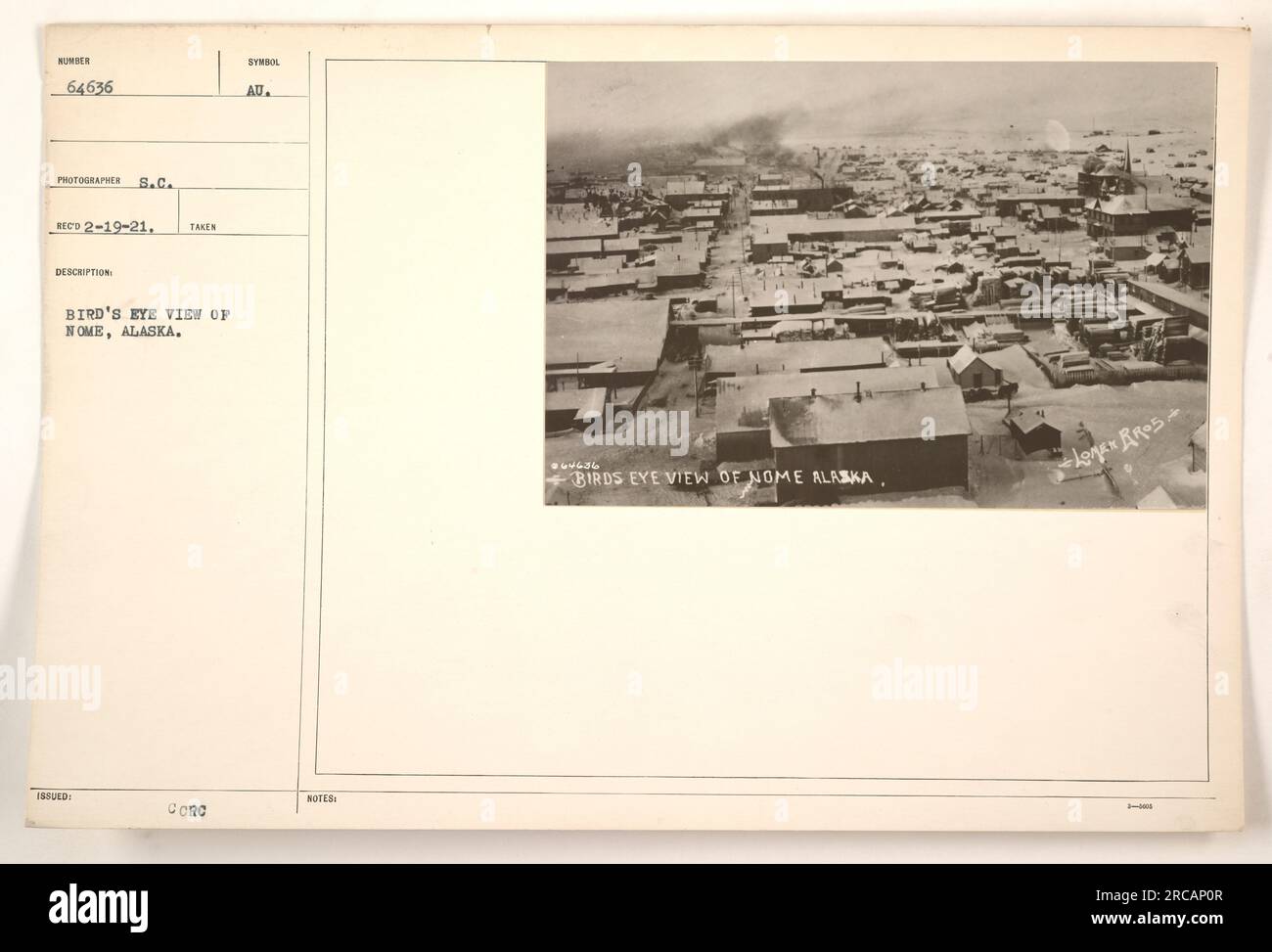 Fotografia aerea di nome, Alaska durante la prima guerra mondiale La foto è stata scattata il 19 febbraio 1921 dal fotografo S.C. Reco. Mostra una vista panoramica della città dall'alto, compresi edifici e strade. L'immagine è contrassegnata con il simbolo CCRC AU ed è corredata dalle note 965636. Foto Stock