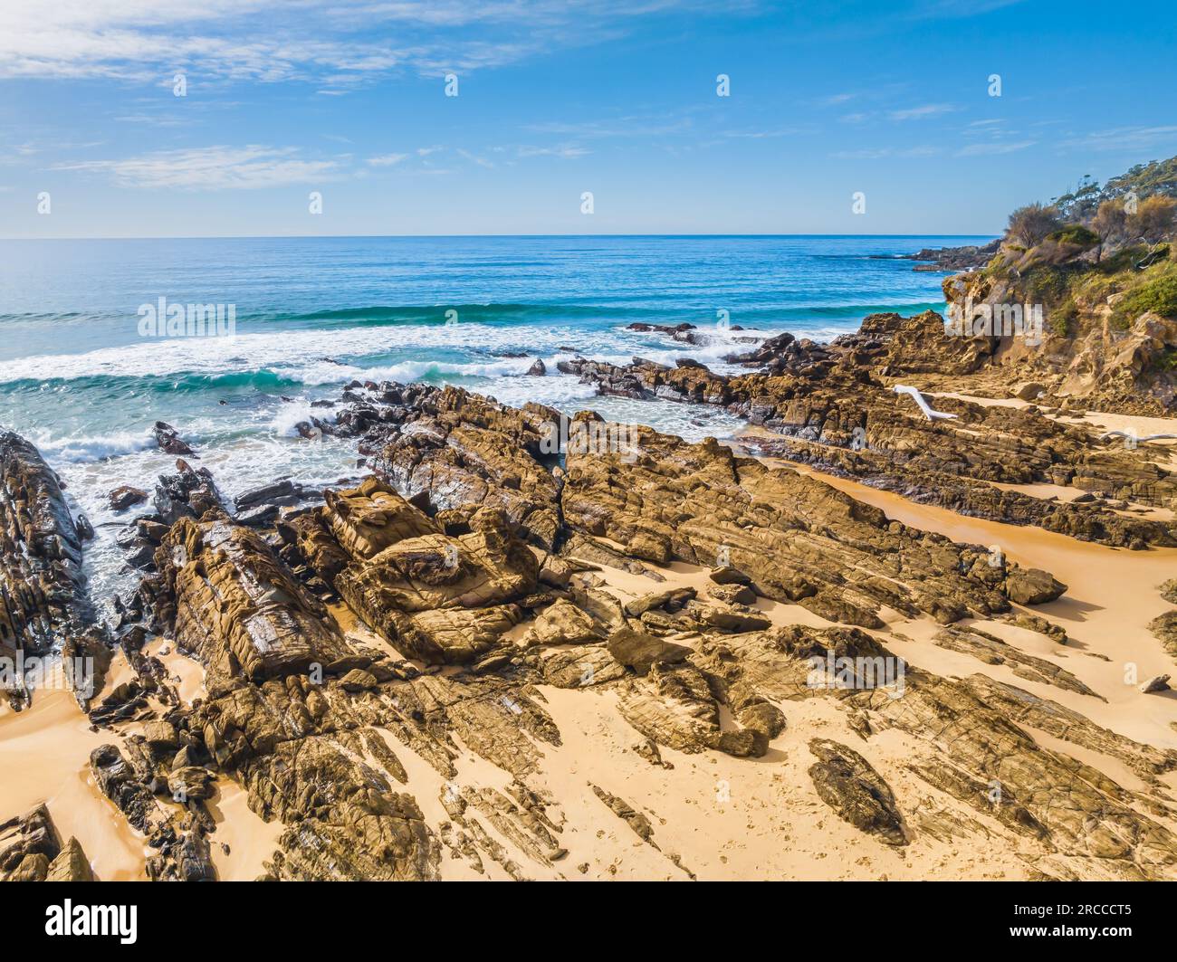 Esplorare Cuttagee Beach sulla costa della costa di Sapphire, nella costa meridionale del New South Wales, Australia Foto Stock