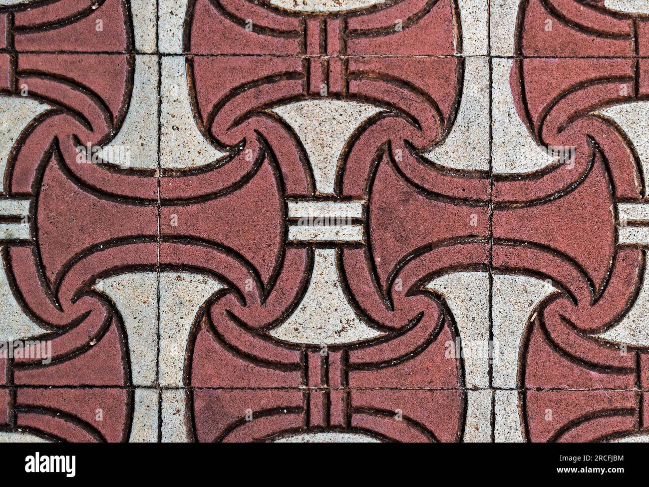 Blocchi di cemento ruvido rosso e bianco sul pavimento Foto Stock