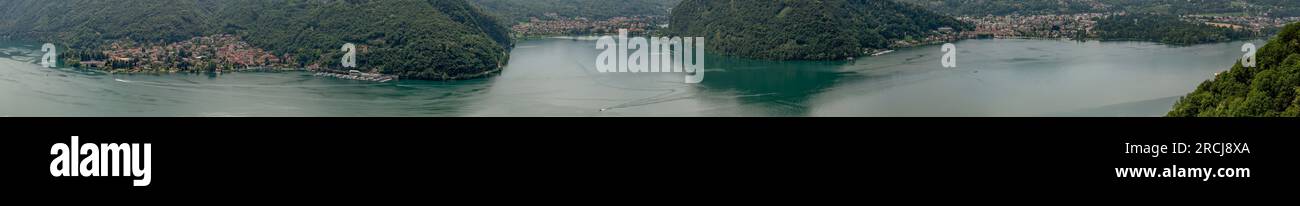 Vista aerea panoramica del Lago di Lugano dal confine italiano ad Agno, Svizzera Foto Stock