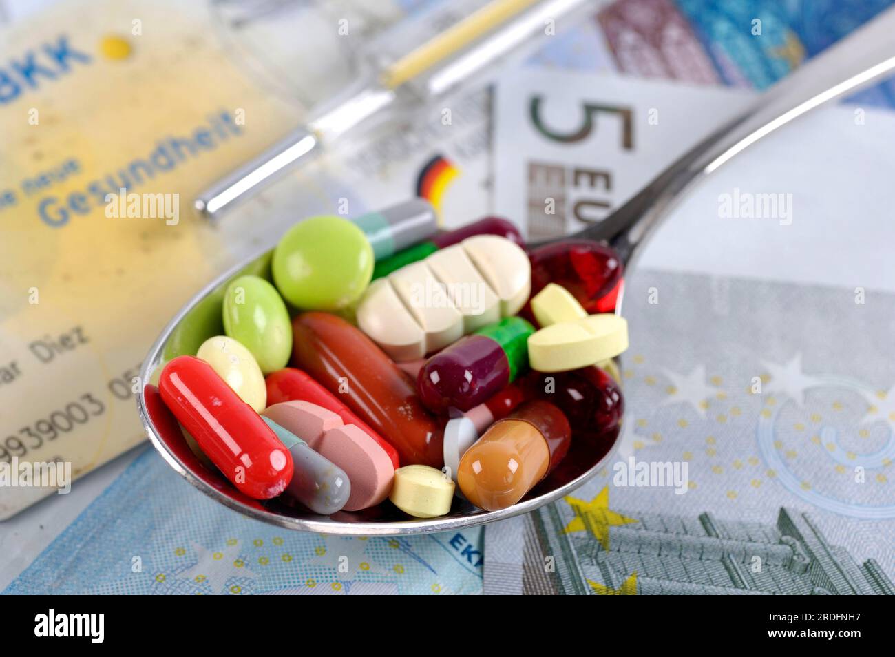 Pillole su cucchiaio, costi di assistenza sanitaria Foto Stock