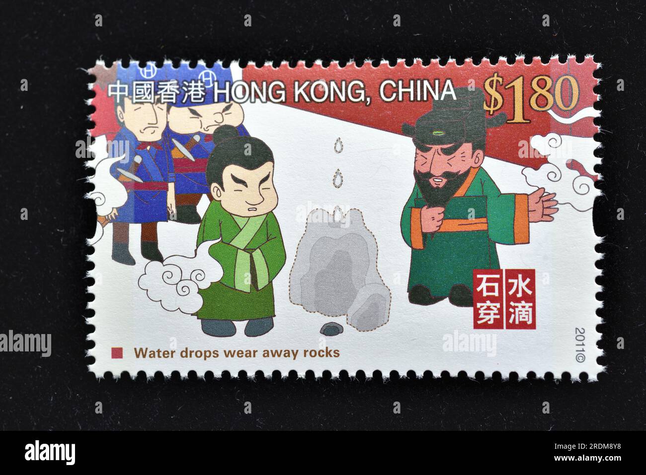 HONG KONG - CIRCA 2011: Un francobollo stampato a Hong Kong mostra Story Behind the Idiom - Water Drops Wear Away Rocks, circa 2011 Foto Stock