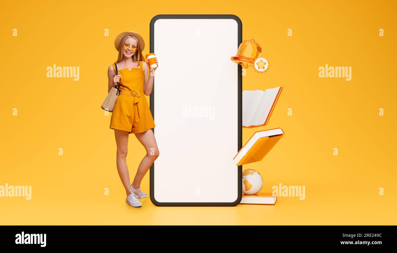Studentessa in posa con ampio schermo dello smartphone su sfondo giallo Foto Stock