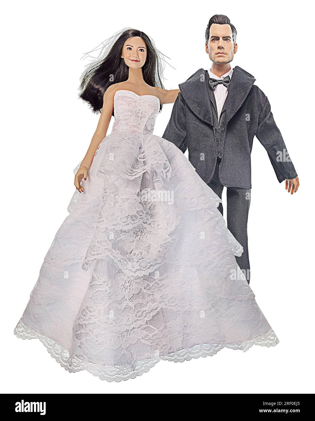 Sposa e sposo indossano abiti da sposa e abiti formali Foto Stock