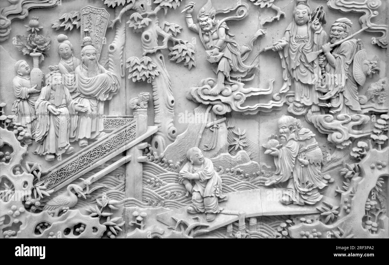 Dettaglio di un antico rilievo storico in pietra visto al Giardino Yuyuan di Shanghai (Cina) Foto Stock
