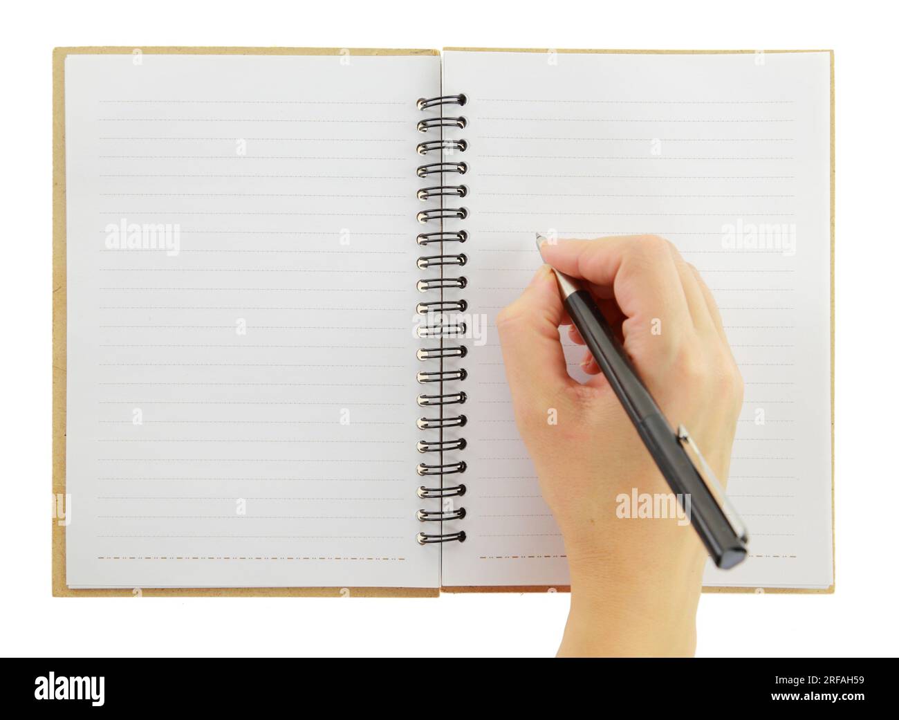 Mano femminile con una penna e un notebook aperto isolato su sfondo bianco, Foto Stock