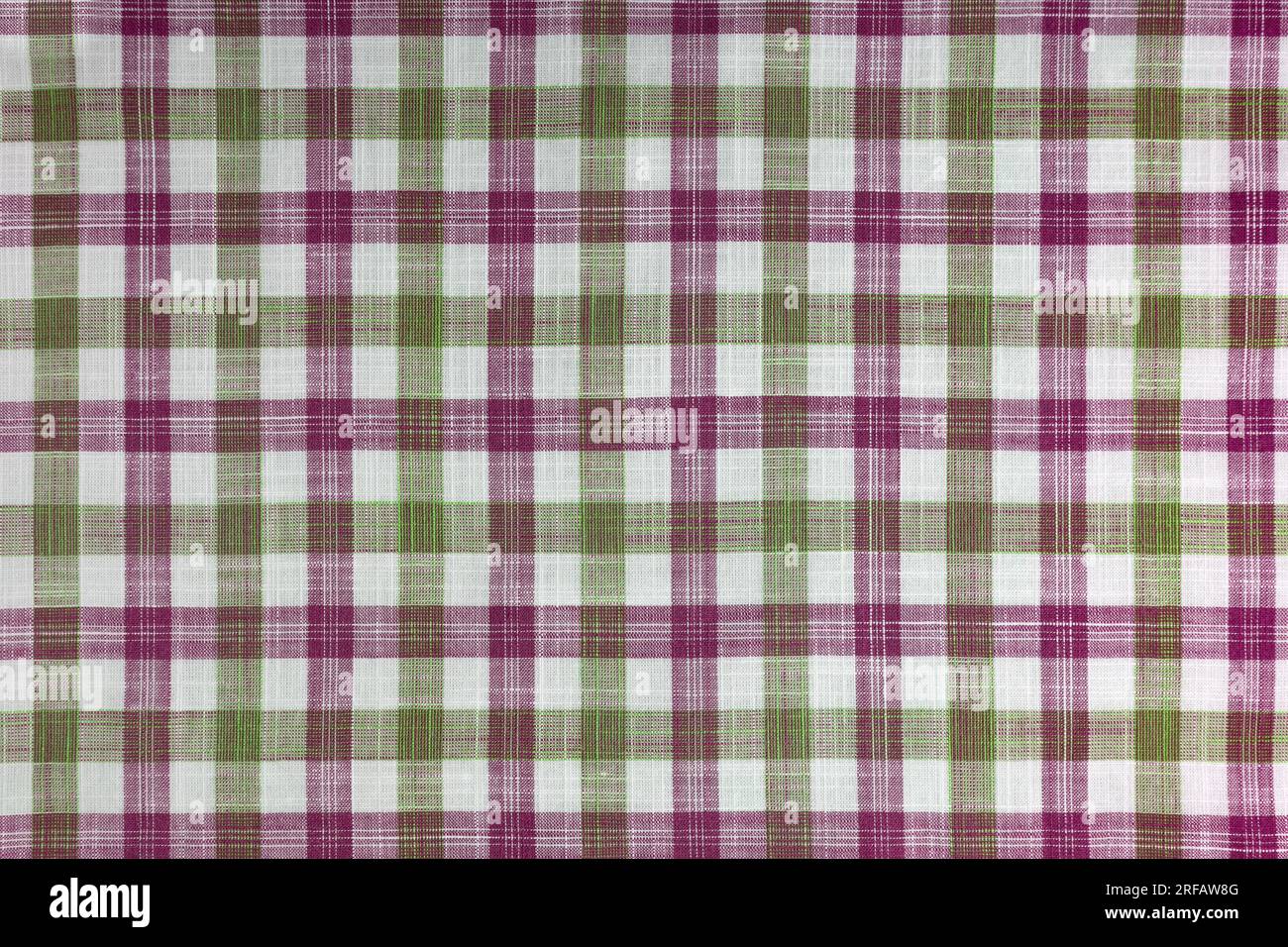 Tessuto a scacchi verde e rosa, motivo tartan. Tessuto camicia, tessuto tovagliato, tela a quadri in lino, motivo a quadri scozzese classico. Sfondo Foto Stock