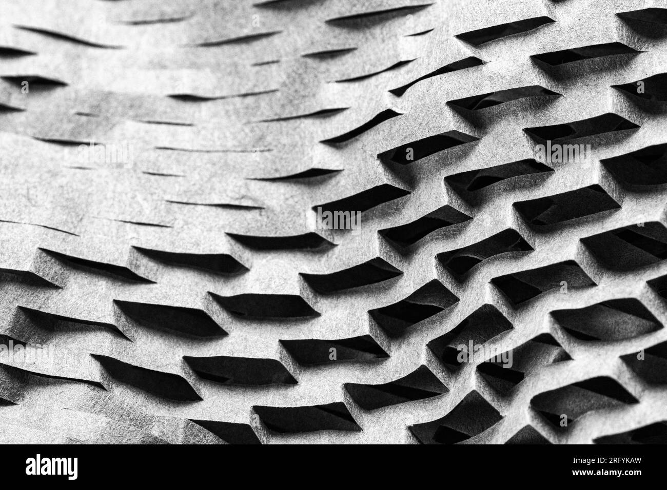 La carta da imballaggio a nido d'ape crea motivi geometrici Foto Stock