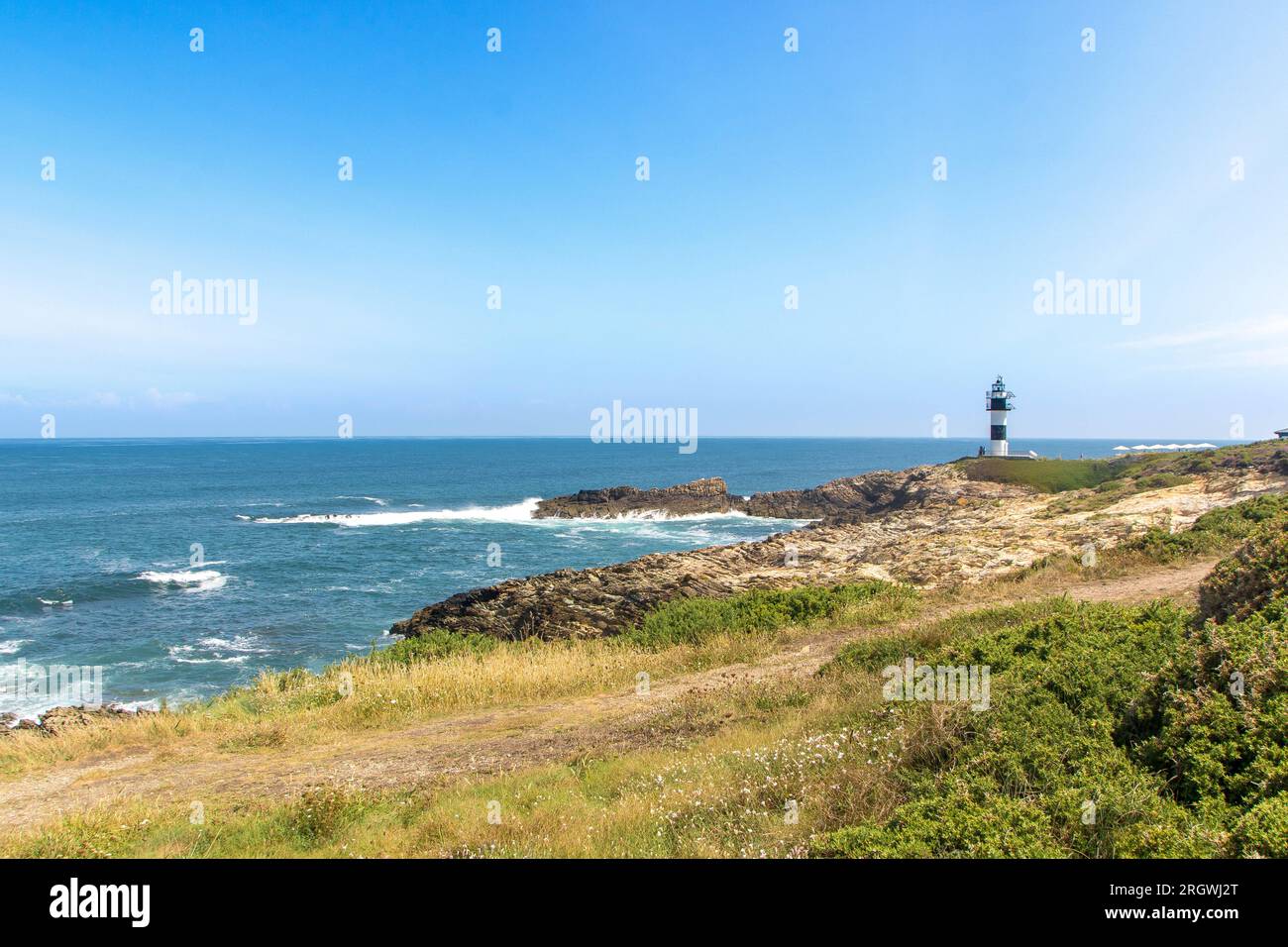 Il faro sull'isla Pancha in Galizia, costa atlantica della Spagna Foto Stock