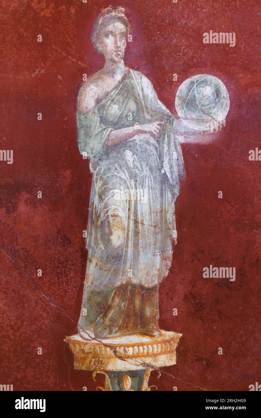 Sito archeologico di Pompei, Campania, Italia. Uno di una serie di affreschi raffiguranti le Muse, in mostra presso la grande palestra, o palestra grande. Foto Stock