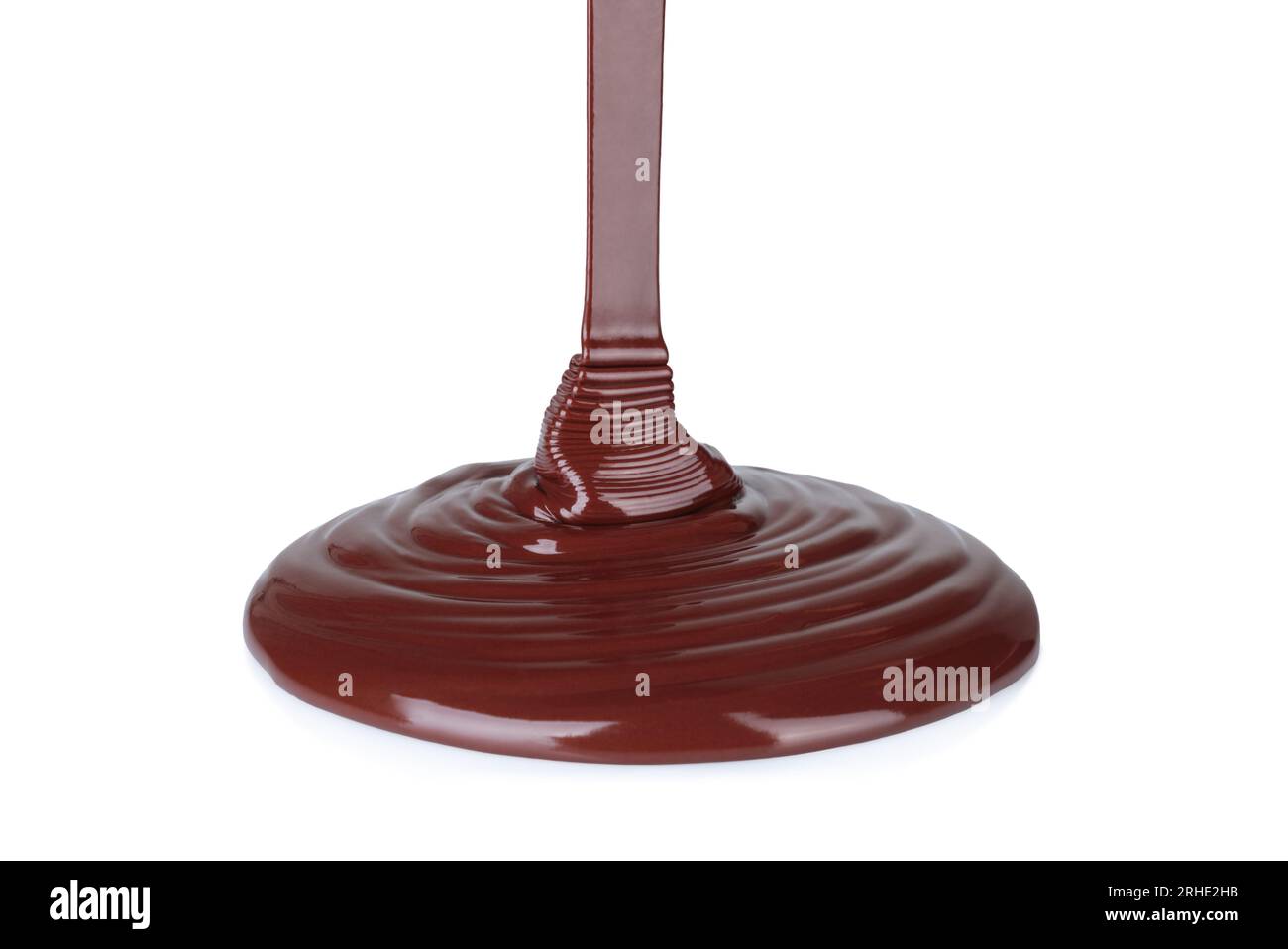 Il cioccolato fuso gocciolamento su sfondo bianco di close-up Foto Stock