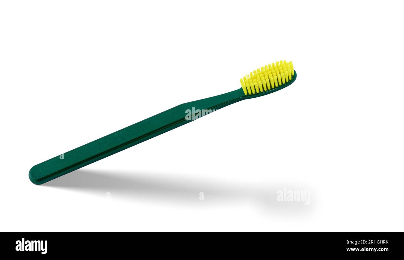 Tagliare lo spazzolino verde. Igiene e protezione quotidiana dei denti. Foto Stock