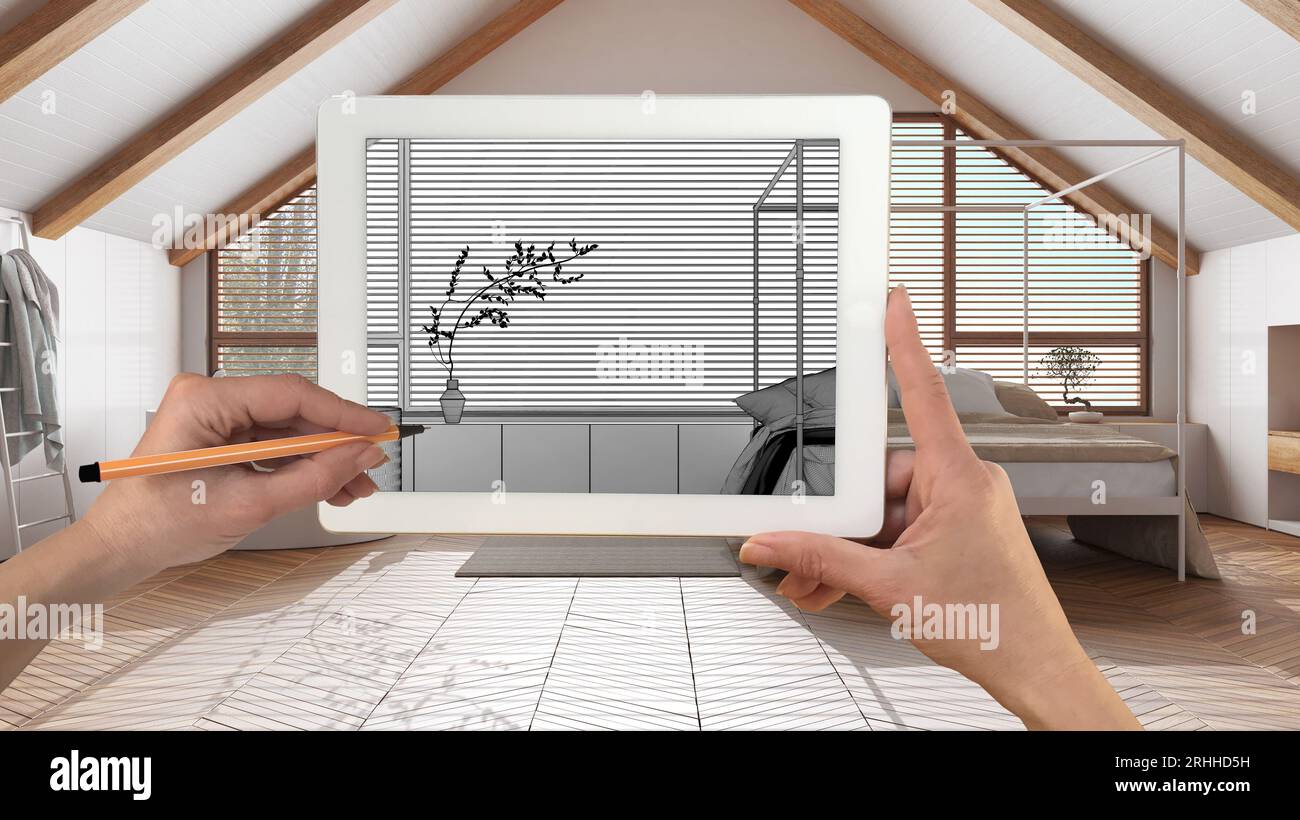 Mani che tengono e disegnano su un tablet che mostra i dettagli della camera da letto del japandi schizzo CAD. Interni rifiniti sullo sfondo, presenta un design architettonico Foto Stock