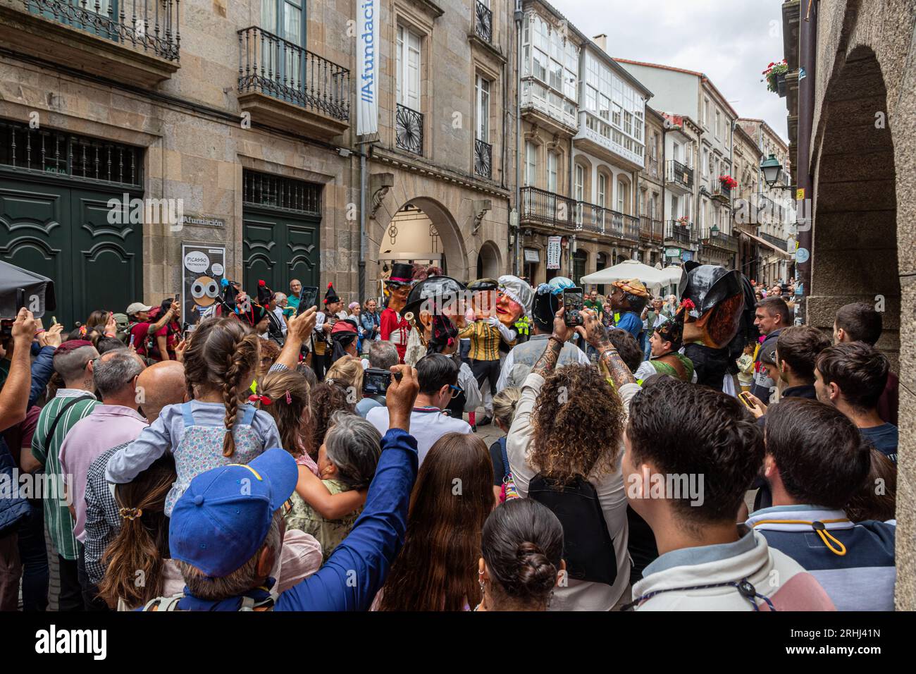 Santiago de Compostela, Spagna. Le teste giganti della Desfile de Cabezudos (Parata dei Capi giganti) in dia del Apostol (giorno degli Apostoli) Foto Stock