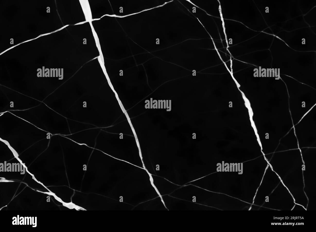 Un primo piano di una superficie nera scura marmorizzata Foto Stock