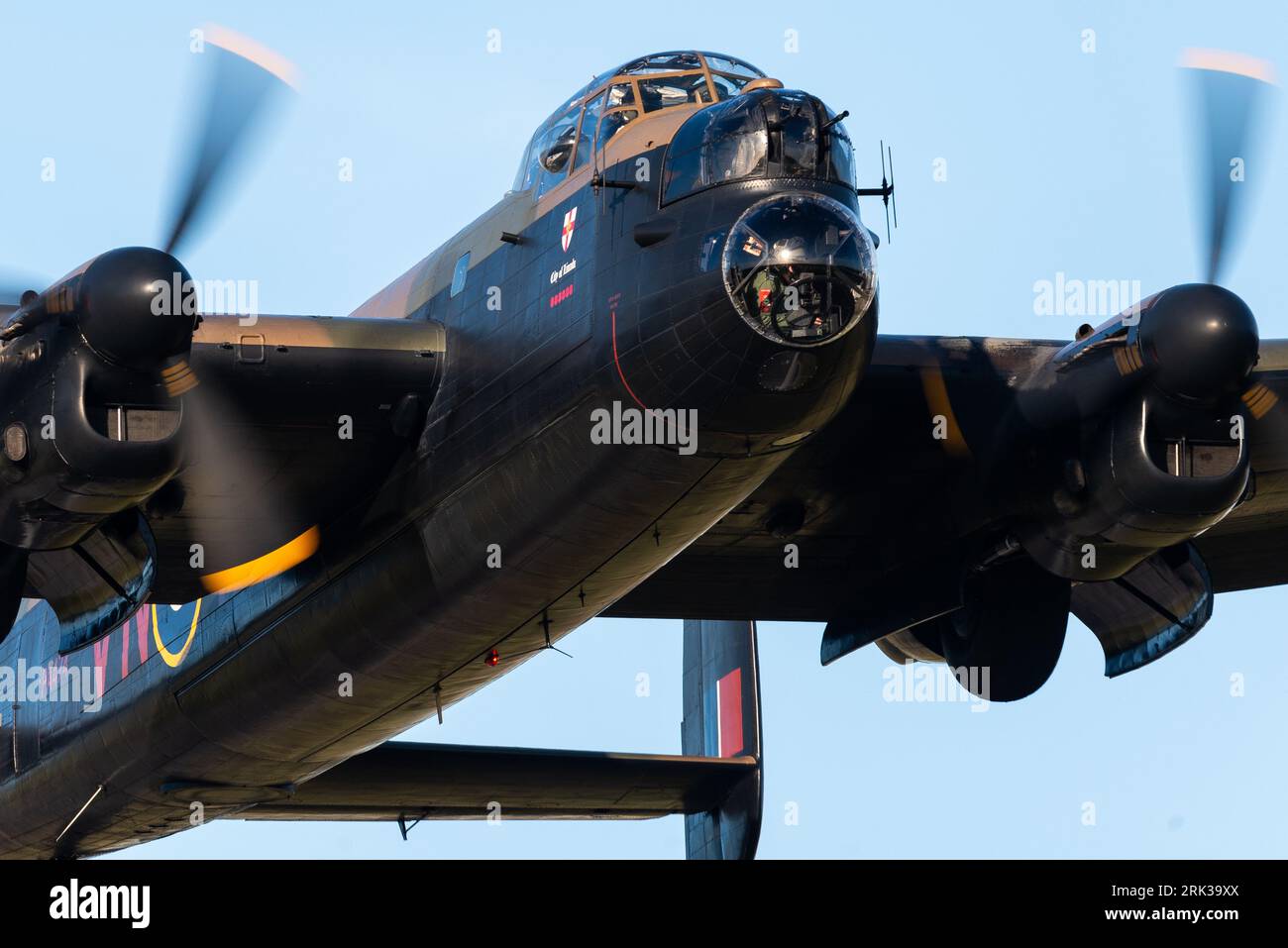 RAF Battle of Britain Memorial Flight Avro Lancaster bomber plane taking off low at London Southend Airport, Essex, UK. Bomb-aimers nose blister Foto Stock