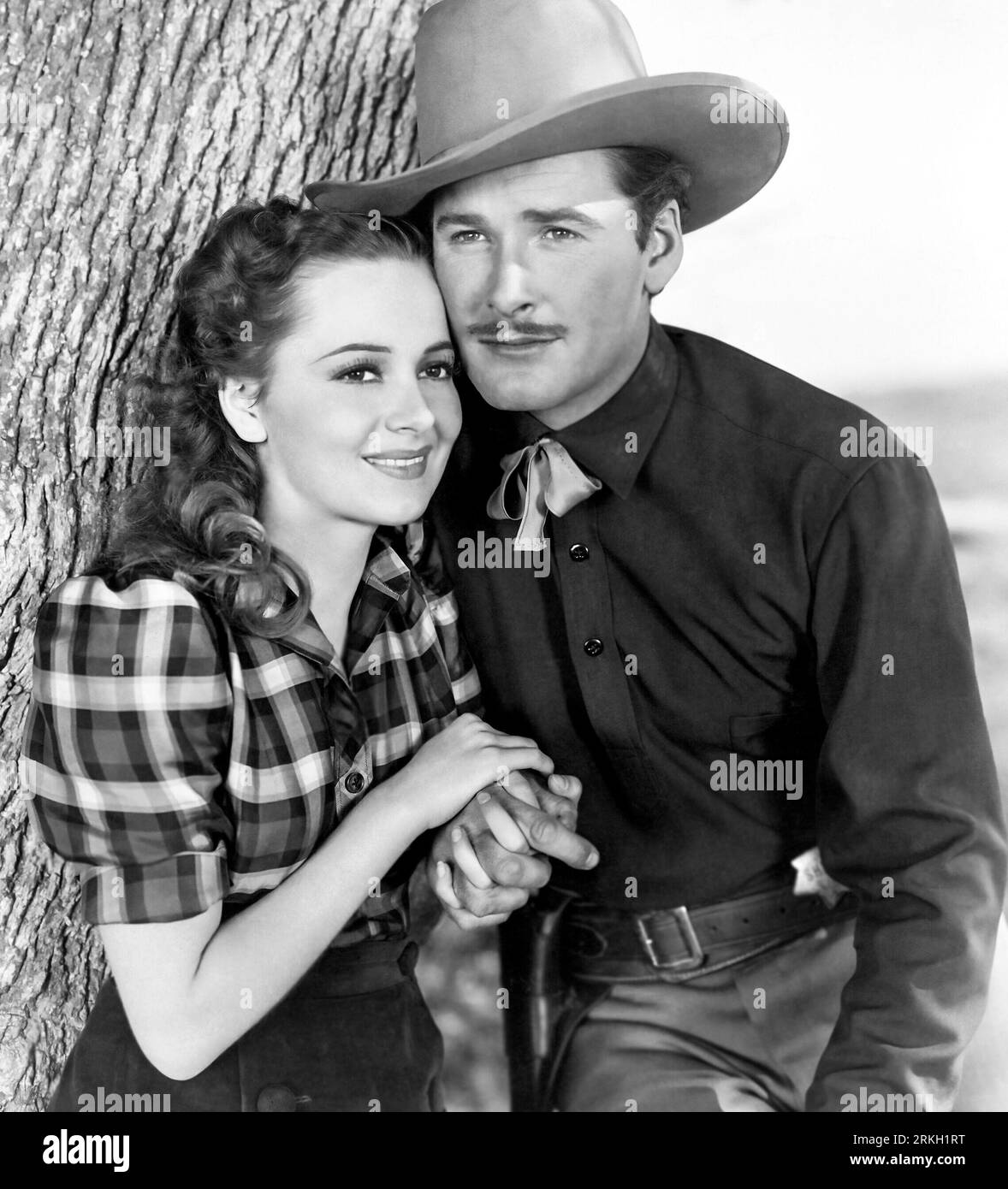 OLIVIA DE HAVILLAND e ERROL FLYNN nella CITTÀ DI DODGE (1939), diretto da MICHAEL CURTIZ. Credit: WARNER BROTHERS / Album Foto Stock