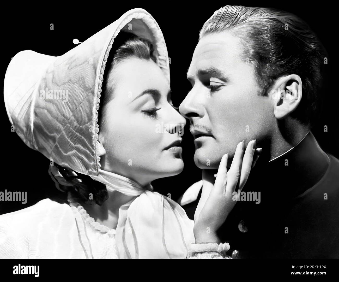 OLIVIA DE HAVILLAND e ERROL FLYNN nel SENTIERO SANTA FE (1940), diretto da MICHAEL CURTIZ. Credit: WARNER BROTHERS / Album Foto Stock