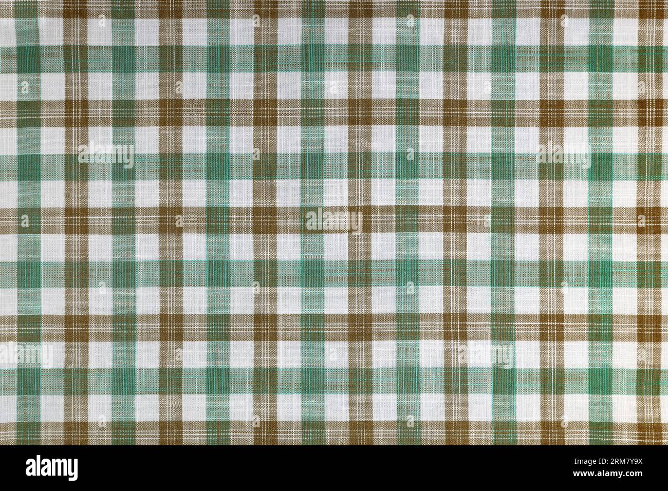 Tessuto a scacchi verde e marrone, motivo tartan. Tessuto camicia, tessuto tovagliato, tela a quadri in lino, motivo a quadri scozzese classico. Backdro Foto Stock