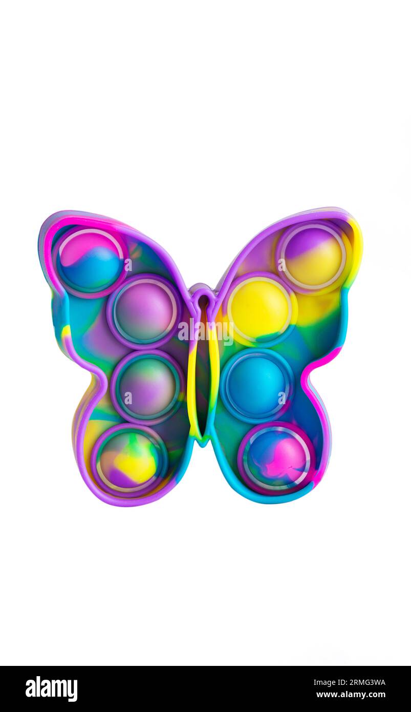 Giocattolo Rainbow push pop it Bubble Sensory fidget sotto forma di farfalla, giocattolo sensoriale antistress alla moda. Anti-ansia e gioco dello stress isolato sulla schiena bianca Foto Stock