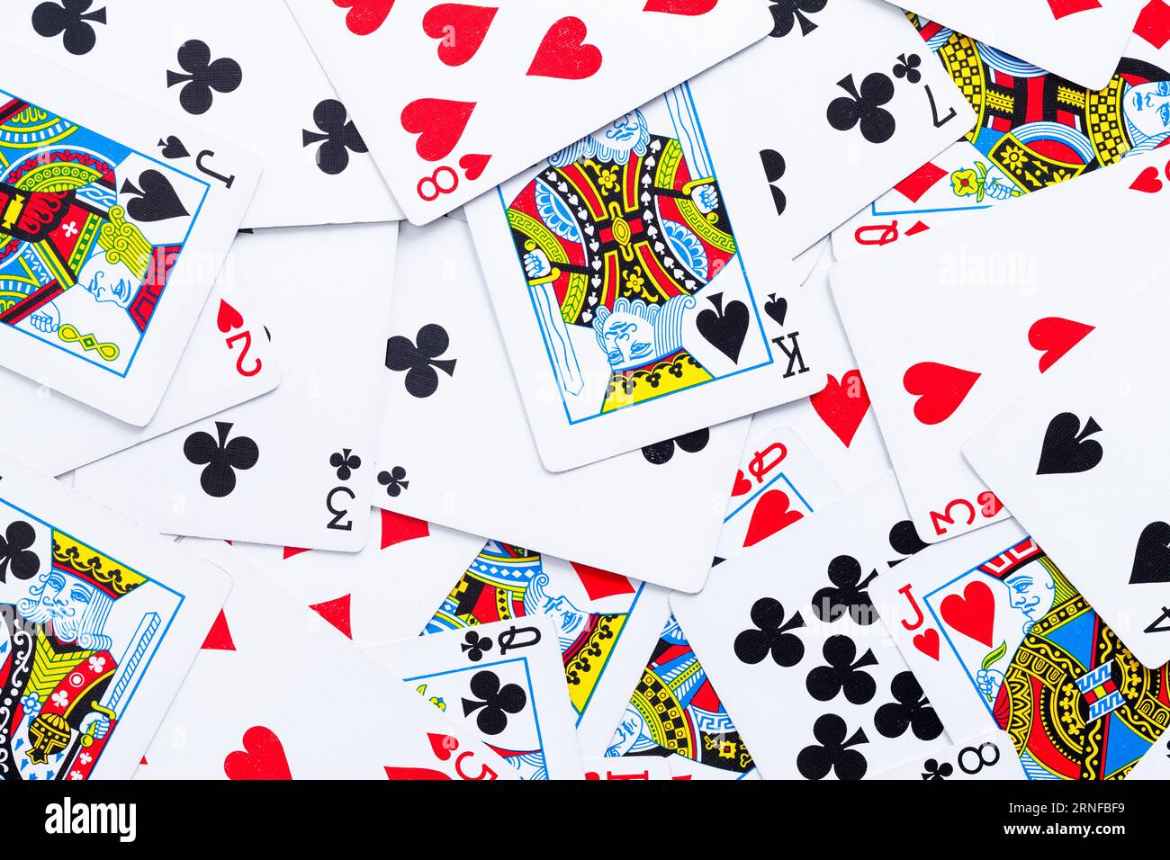 Primo piano sullo sfondo di Flat pile of Gambling Paying Cards. Foto Stock