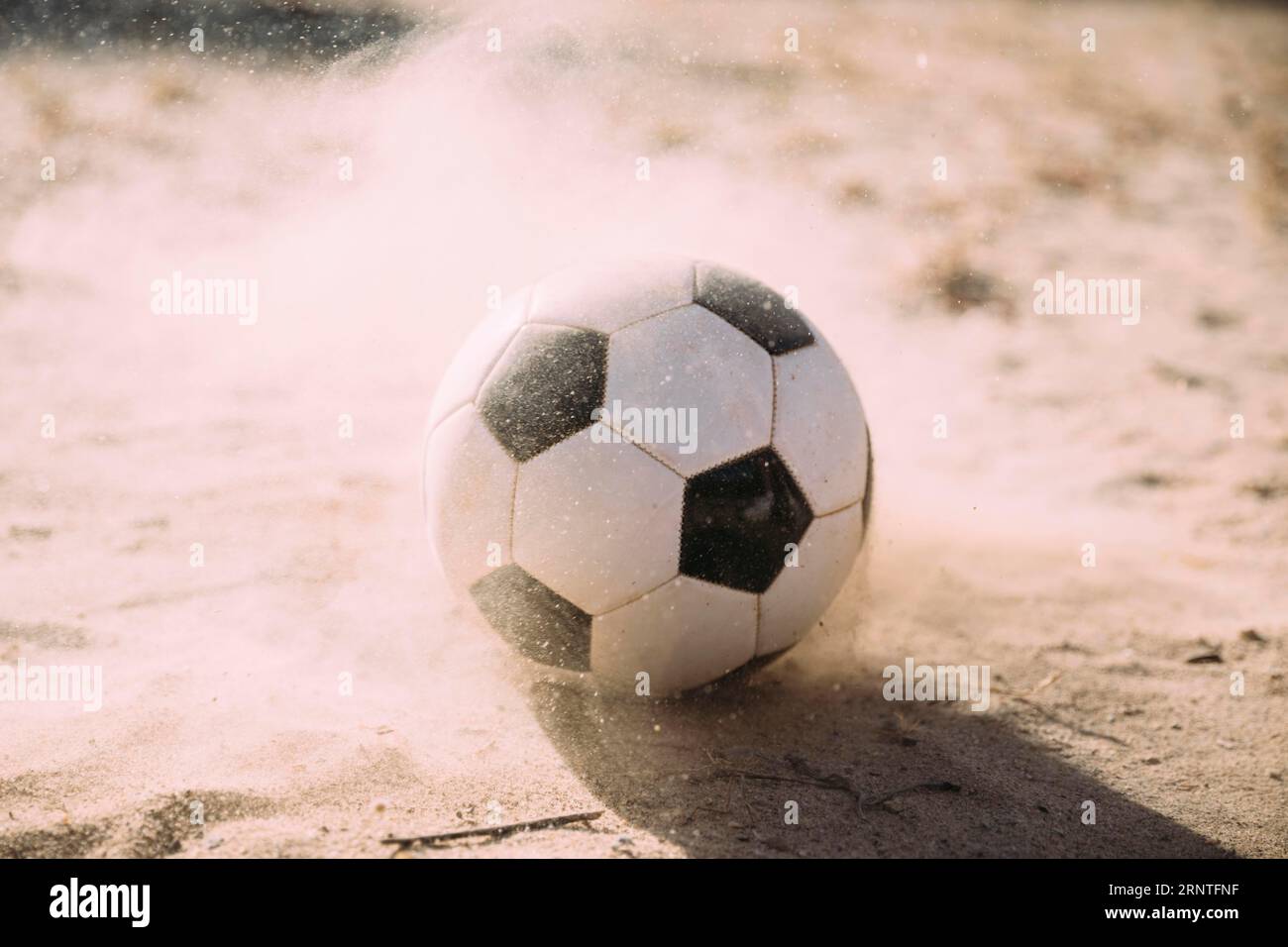 Pallina da calcio particelle di sabbia Foto Stock